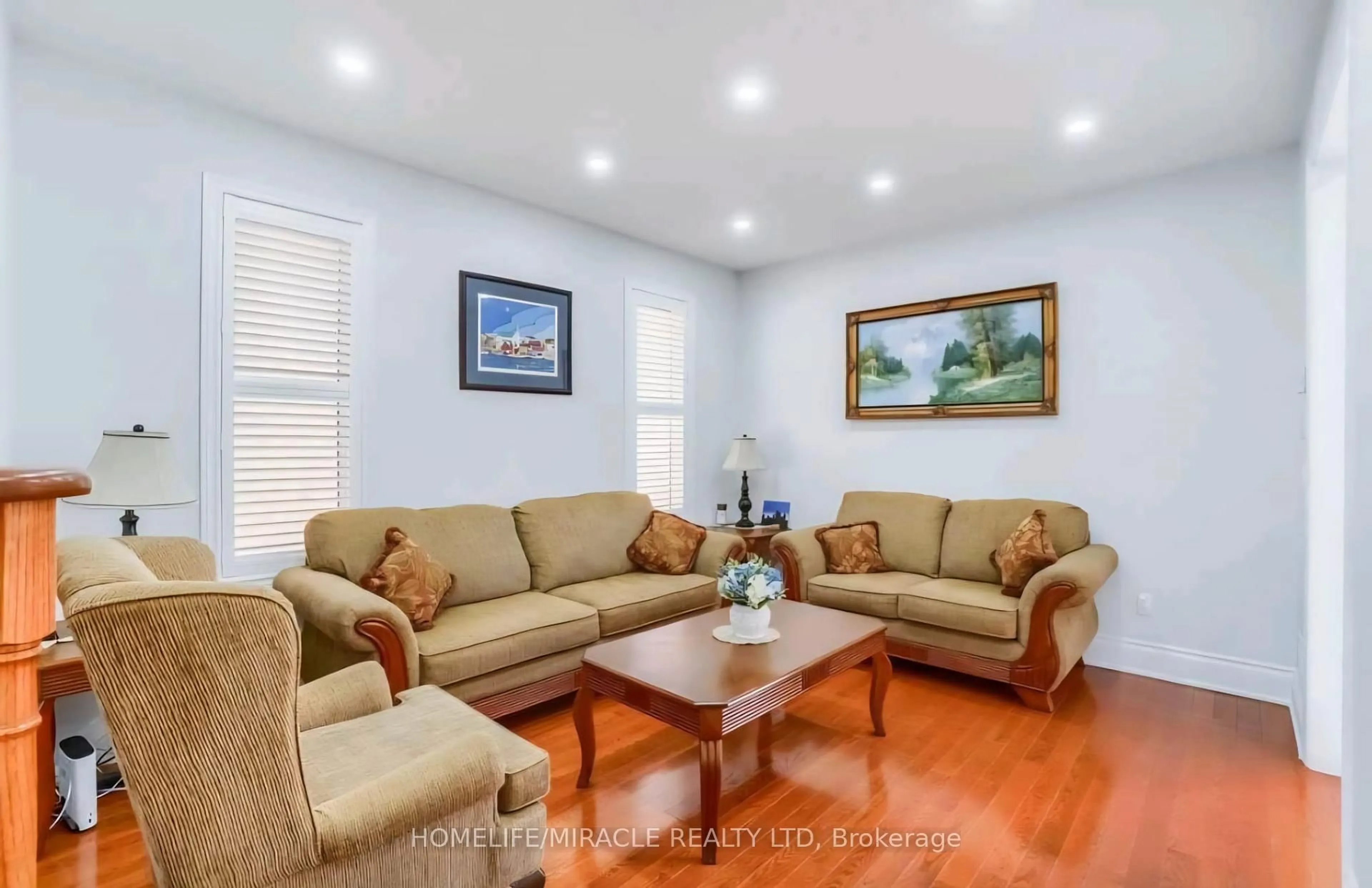 Living room with furniture, wood/laminate floor for 98 Speedwell St, Brampton Ontario L6X 5H1
