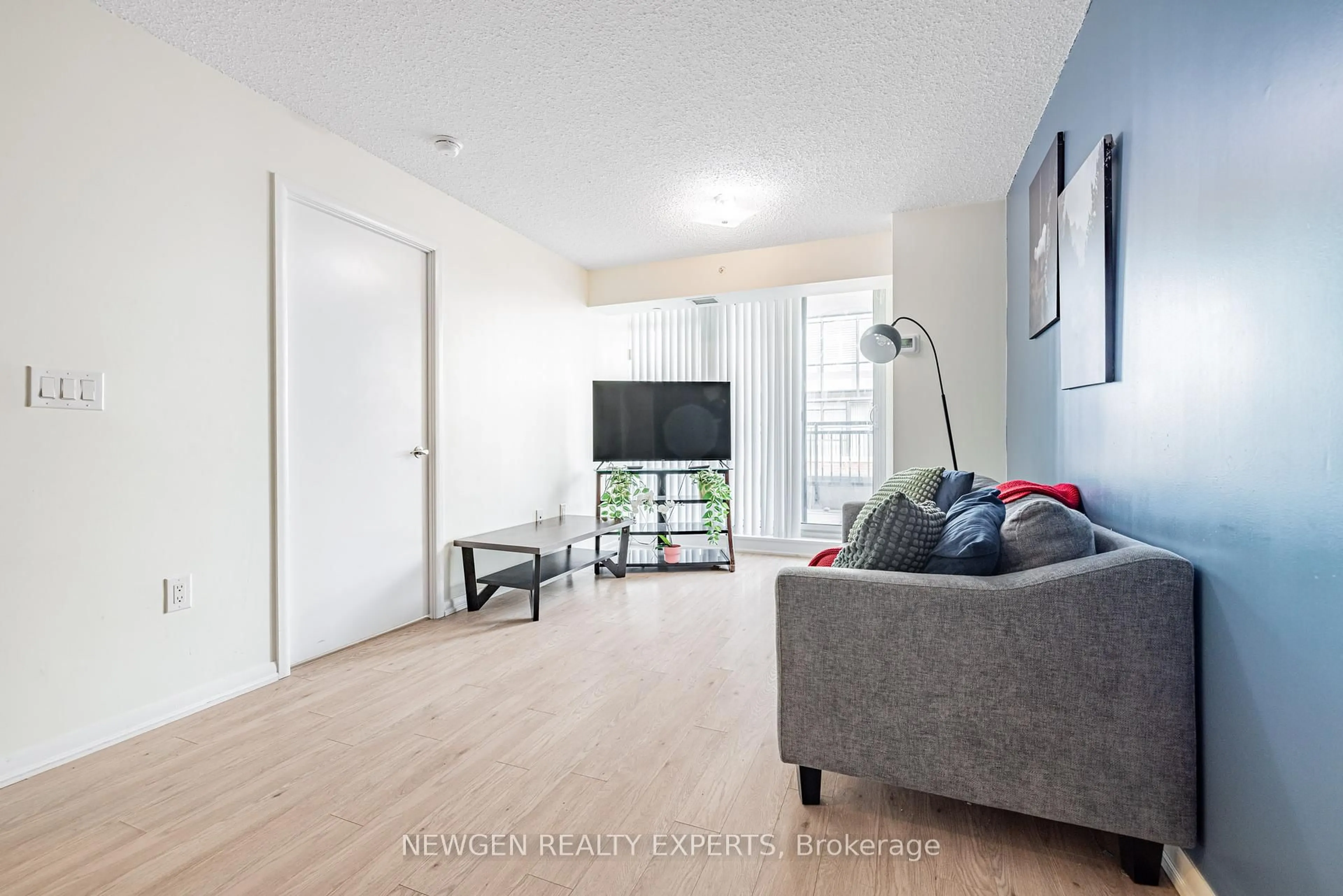 Living room with furniture, wood/laminate floor for 800 Lawrence Ave #704, Toronto Ontario M6A 0B1