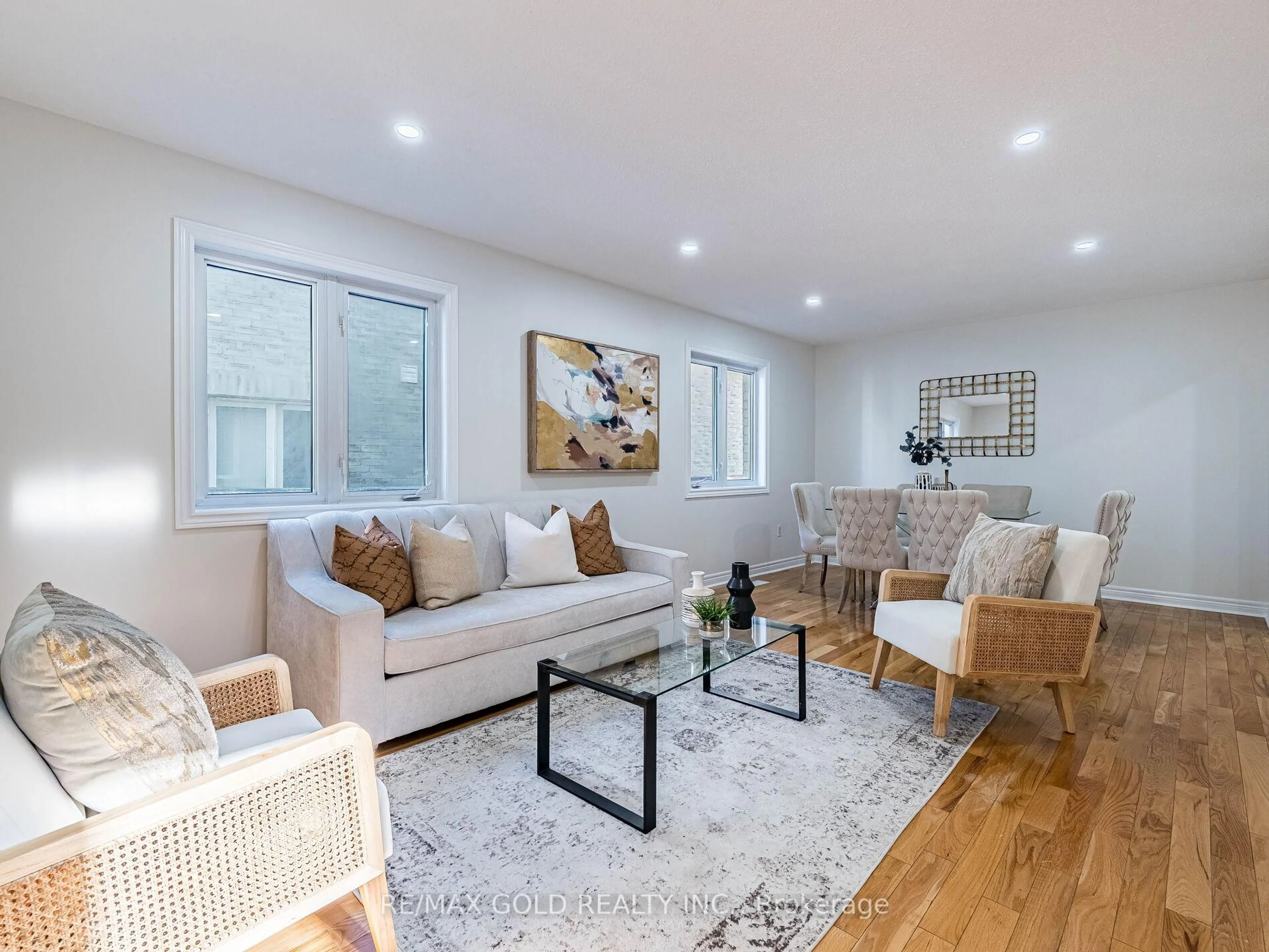 Living room with furniture, wood/laminate floor for 26 Yuile Crt, Brampton Ontario L6Y 5J5