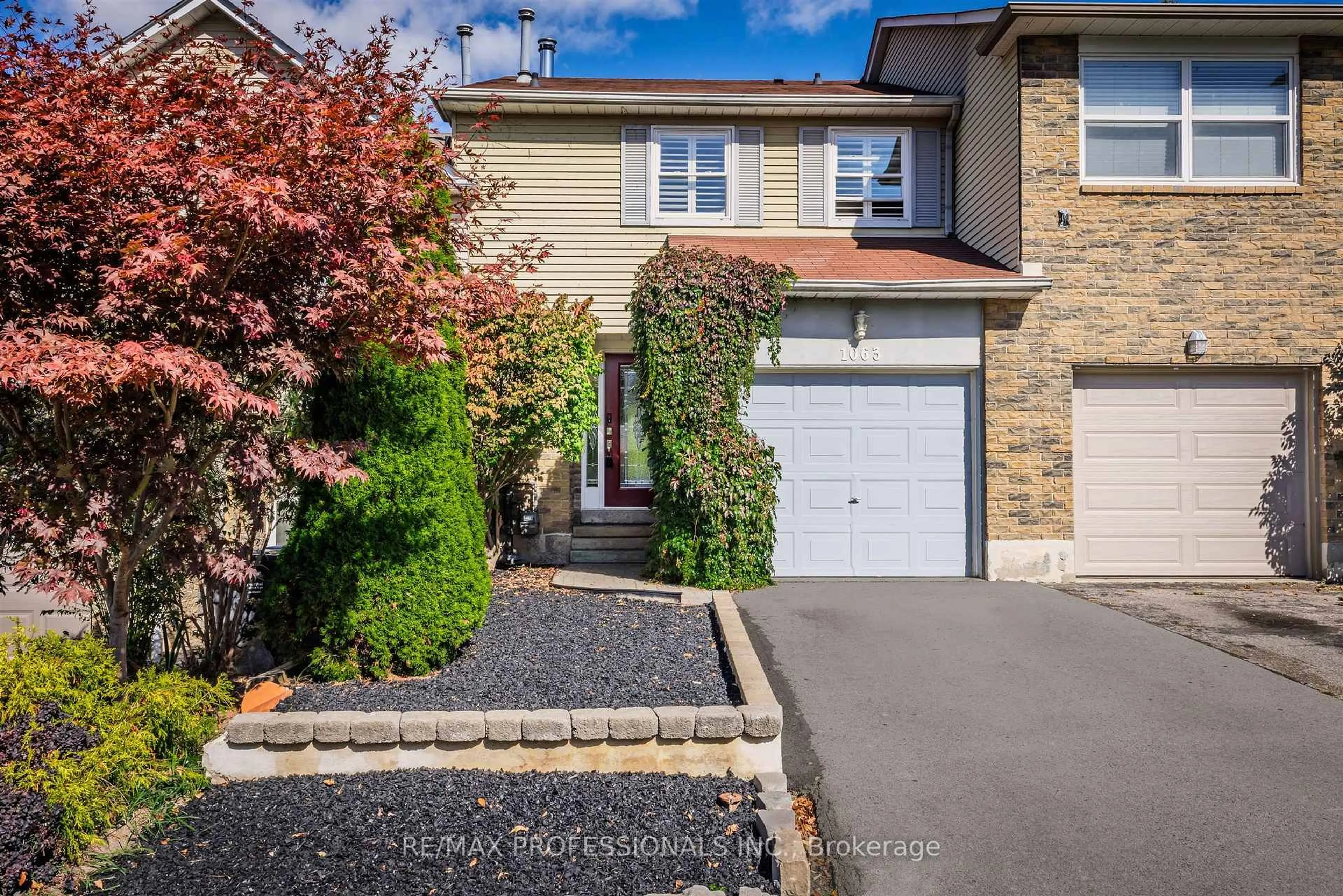 Home with brick exterior material, street for 1063 Raintree Lane, Mississauga Ontario L5H 4A1