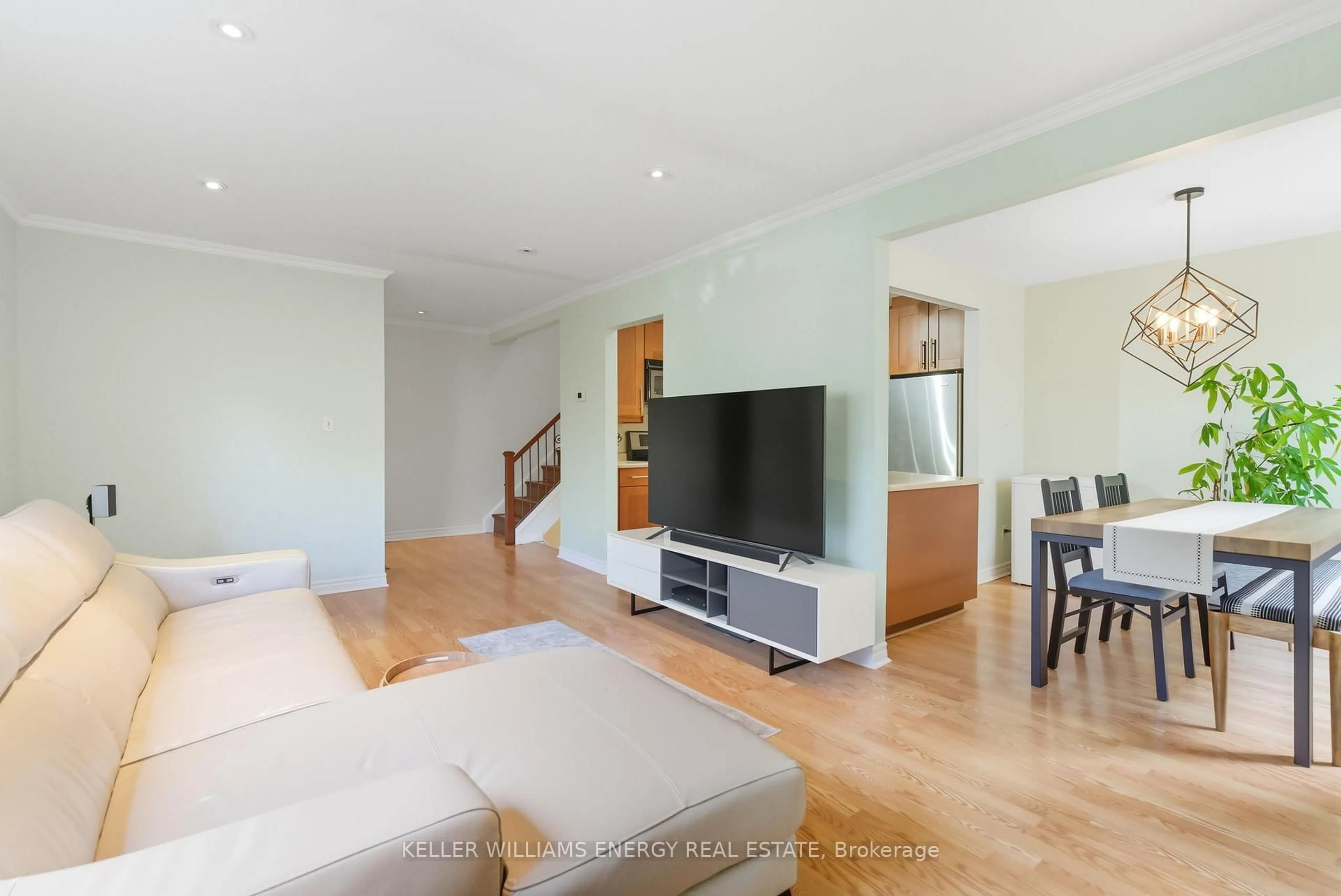 Living room with furniture, wood/laminate floor for 693 Francis Rd #4, Burlington Ontario L7T 3X6