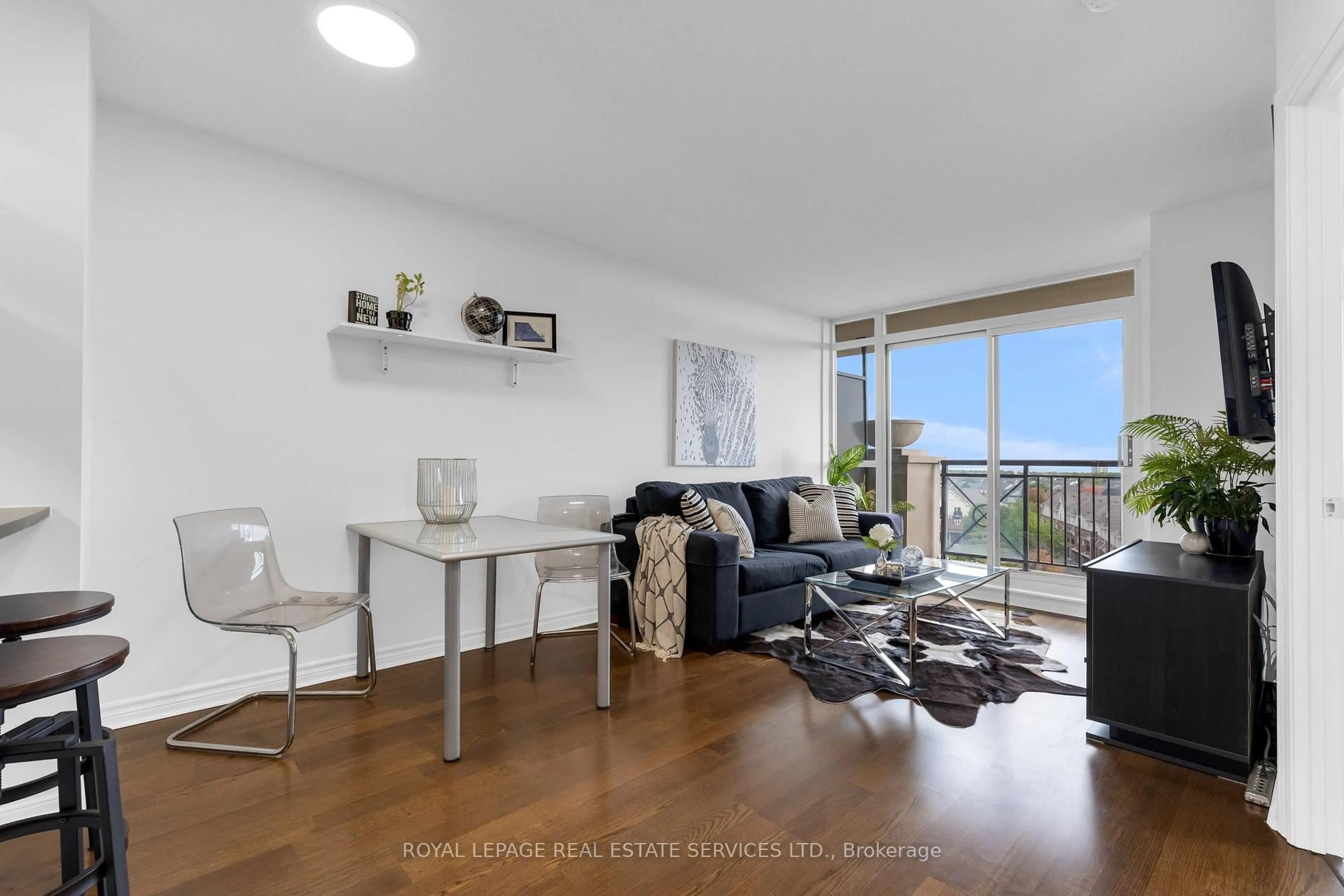 Living room with furniture, wood/laminate floor for 2379 Central Park Dr #708, Oakville Ontario L6H 0E4