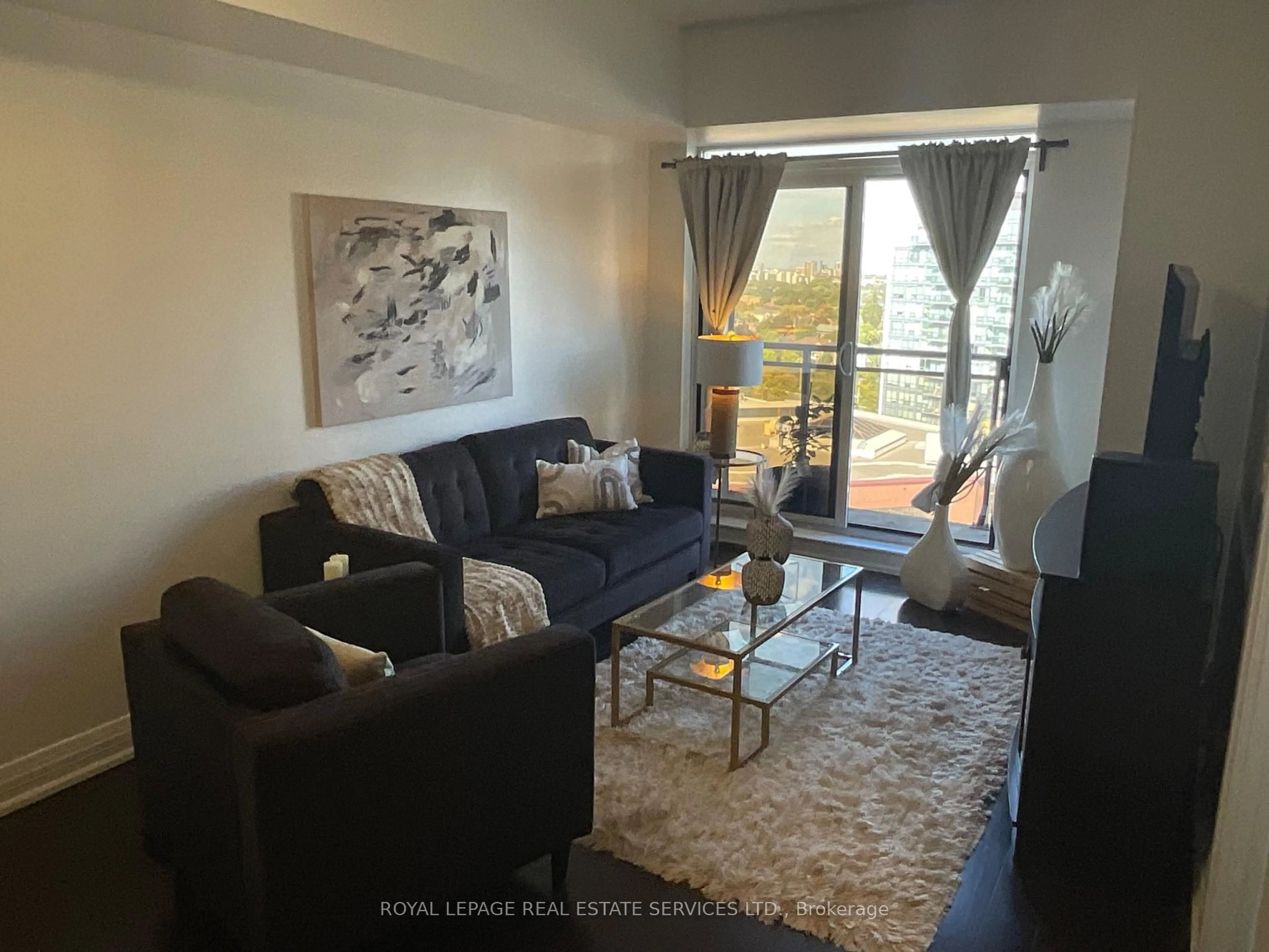 Living room with furniture, wood/laminate floor for 55 De Boers Dr #1203, Toronto Ontario M3J 0G5