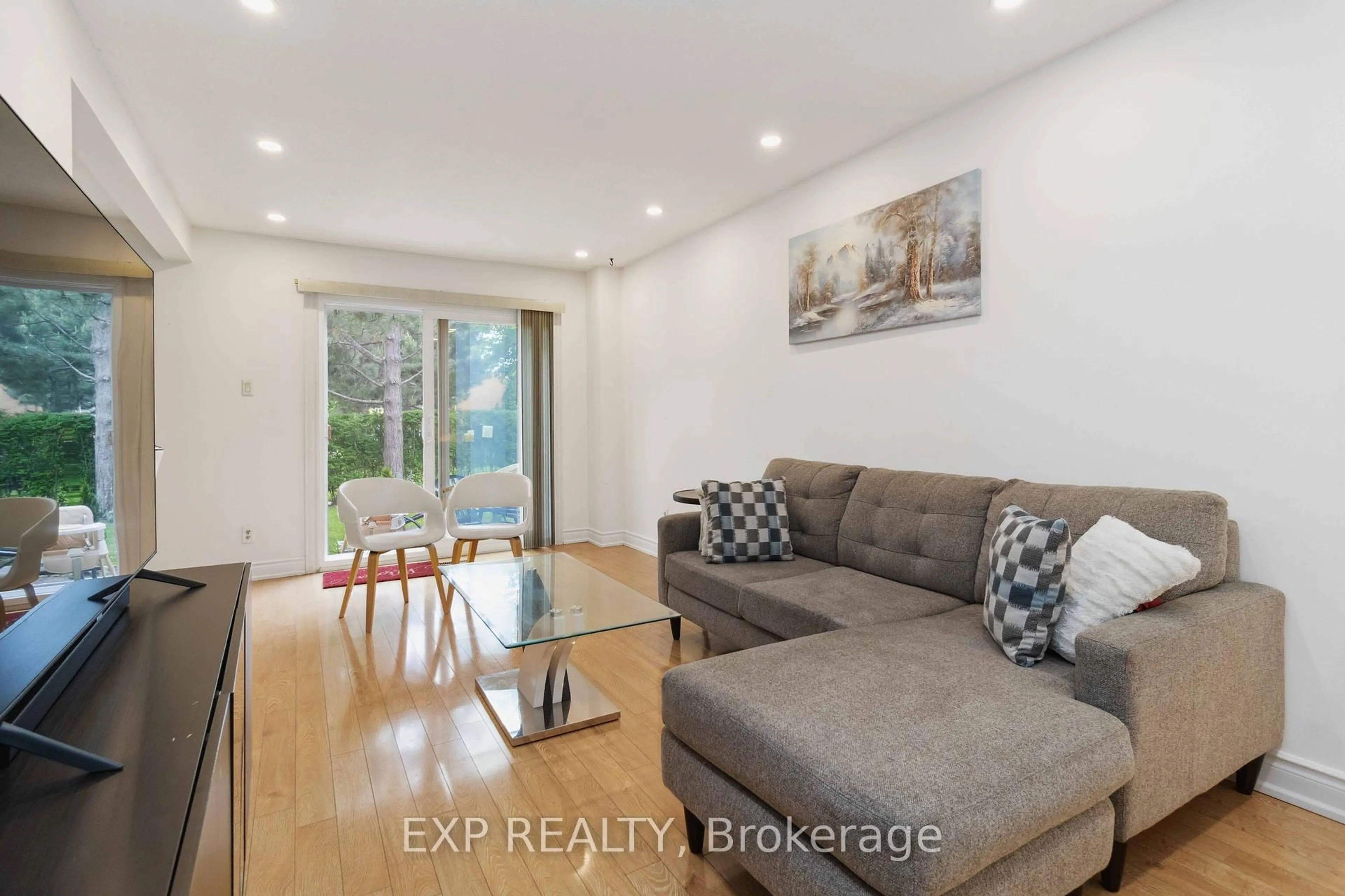 Living room with furniture, wood/laminate floor for 1180 Mississauga Valley Blvd #115, Mississauga Ontario L5A 3M9