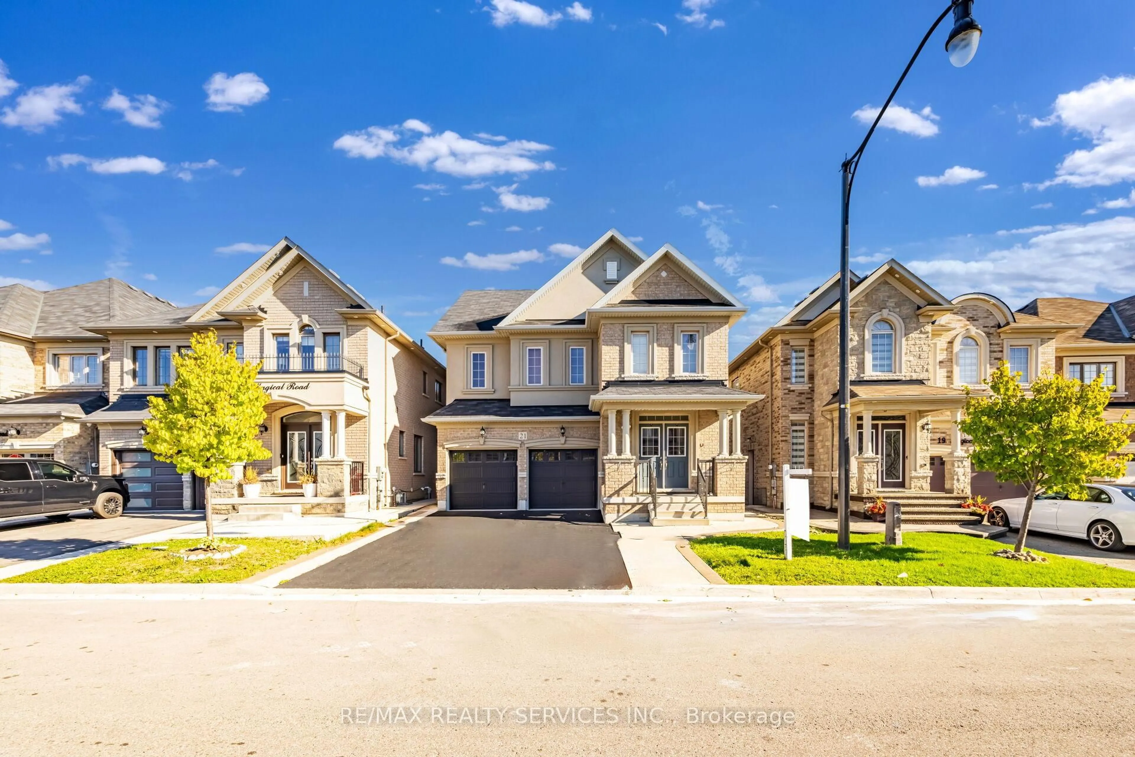 Home with brick exterior material, street for 21 Magical Rd, Brampton Ontario L7A 4P8