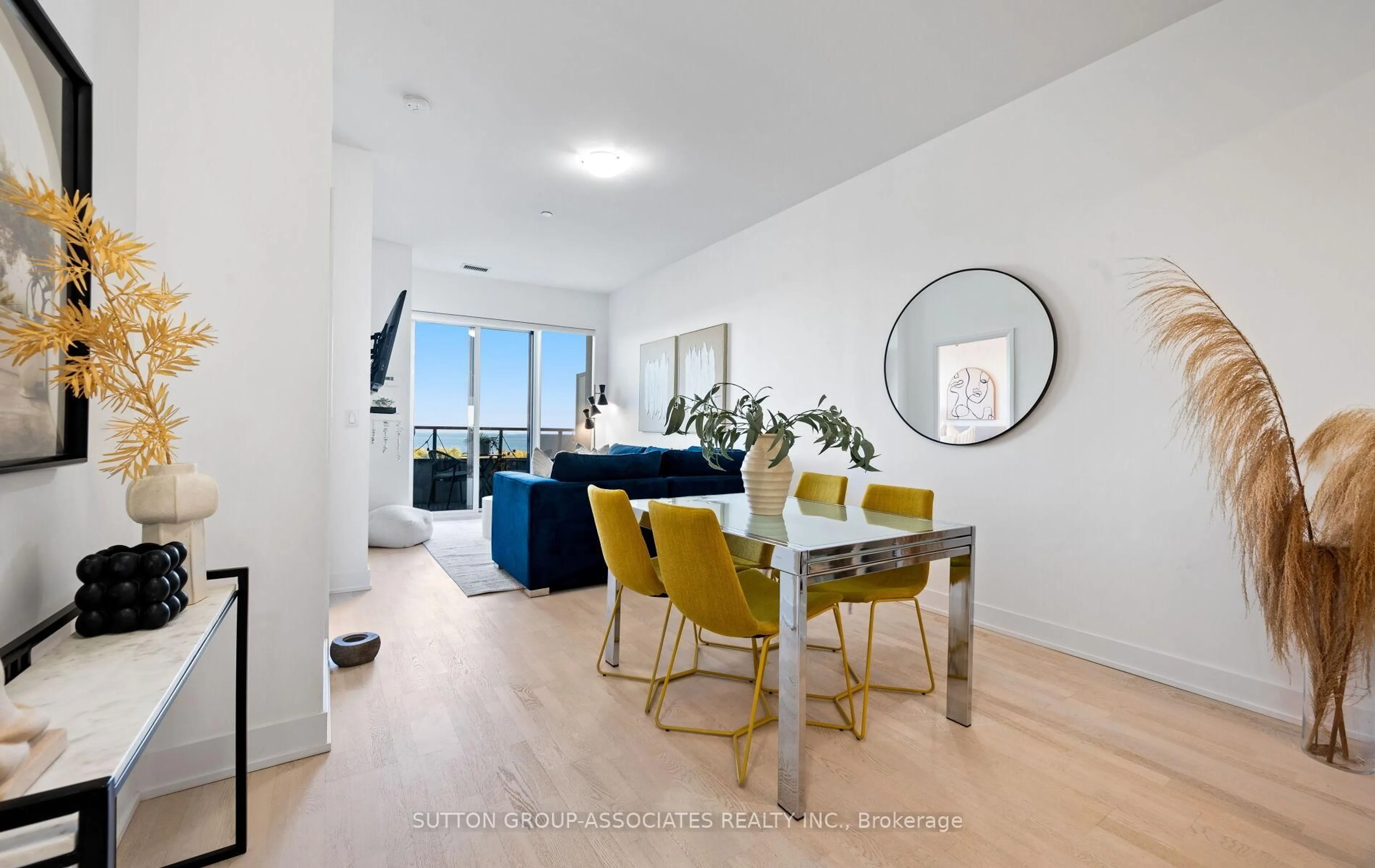 Living room with furniture, wood/laminate floor for 20 Shore Breeze Dr #703, Toronto Ontario M8V 0C7