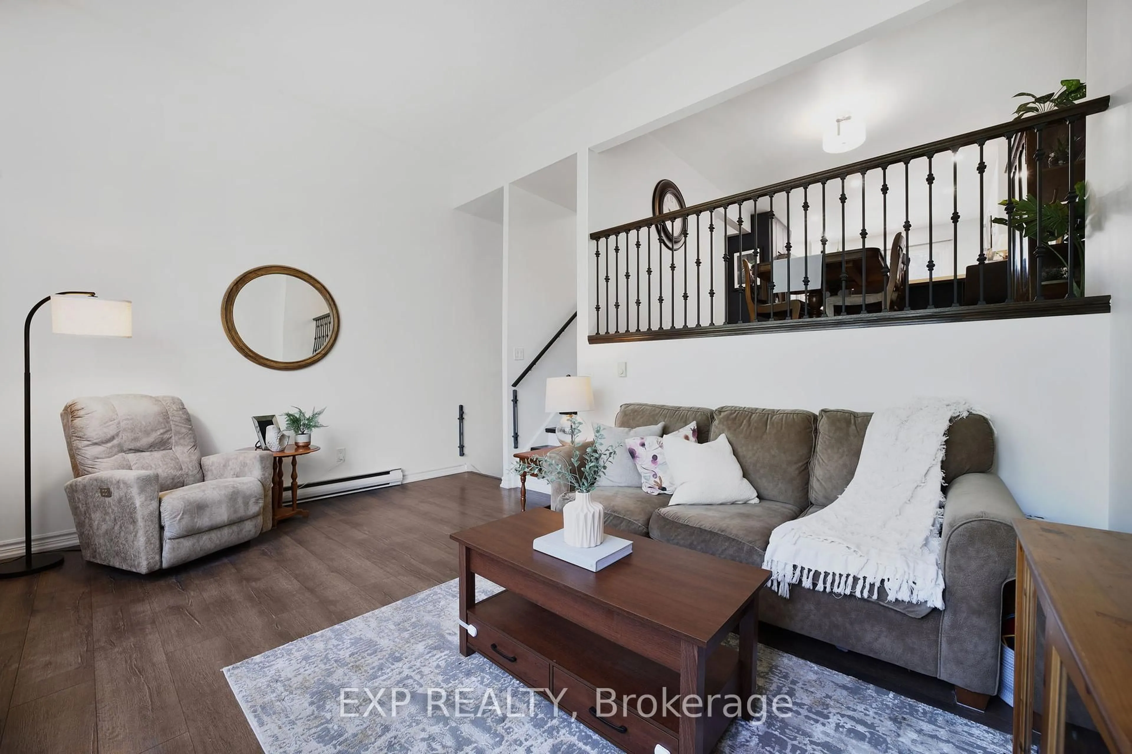 Living room with furniture, wood/laminate floor for 136 Darras Crt, Brampton Ontario L6T 1W7