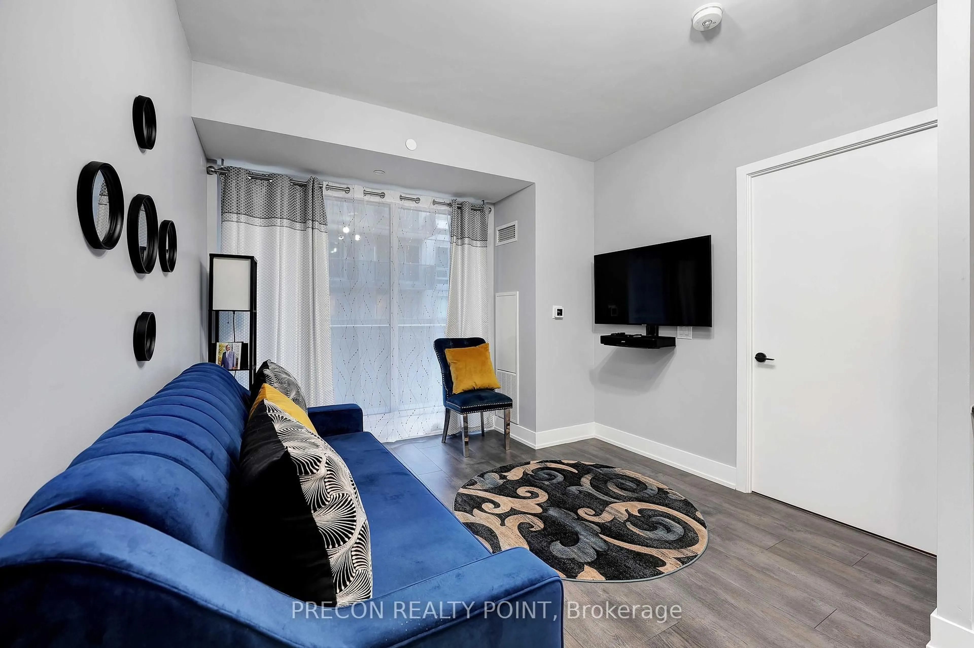 Living room with furniture, unknown for 2450 Old Bronte Rd #322, Oakville Ontario L5M 5P6