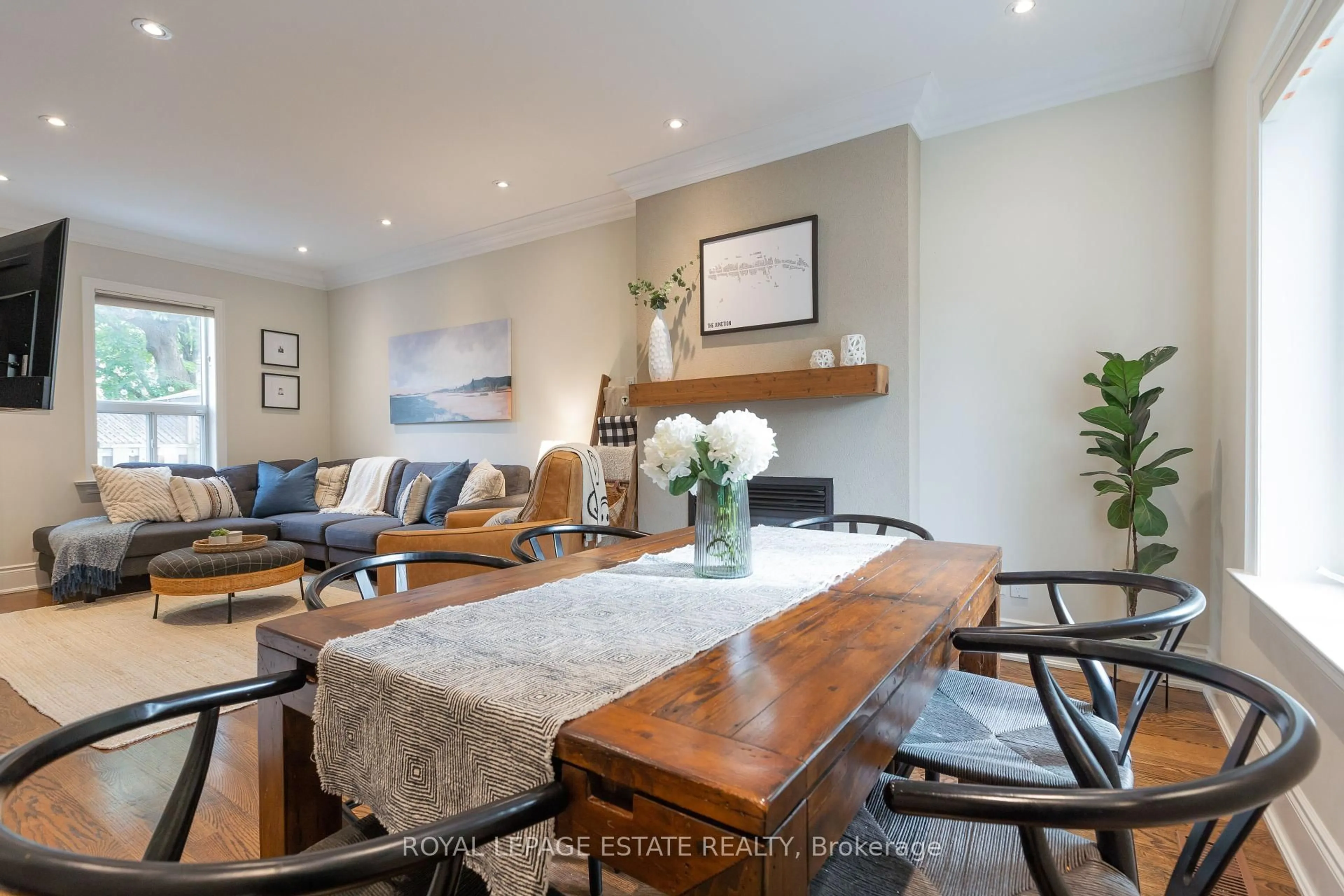 Living room with furniture, wood/laminate floor for 24 Maher Ave, Toronto Ontario M6P 1S6