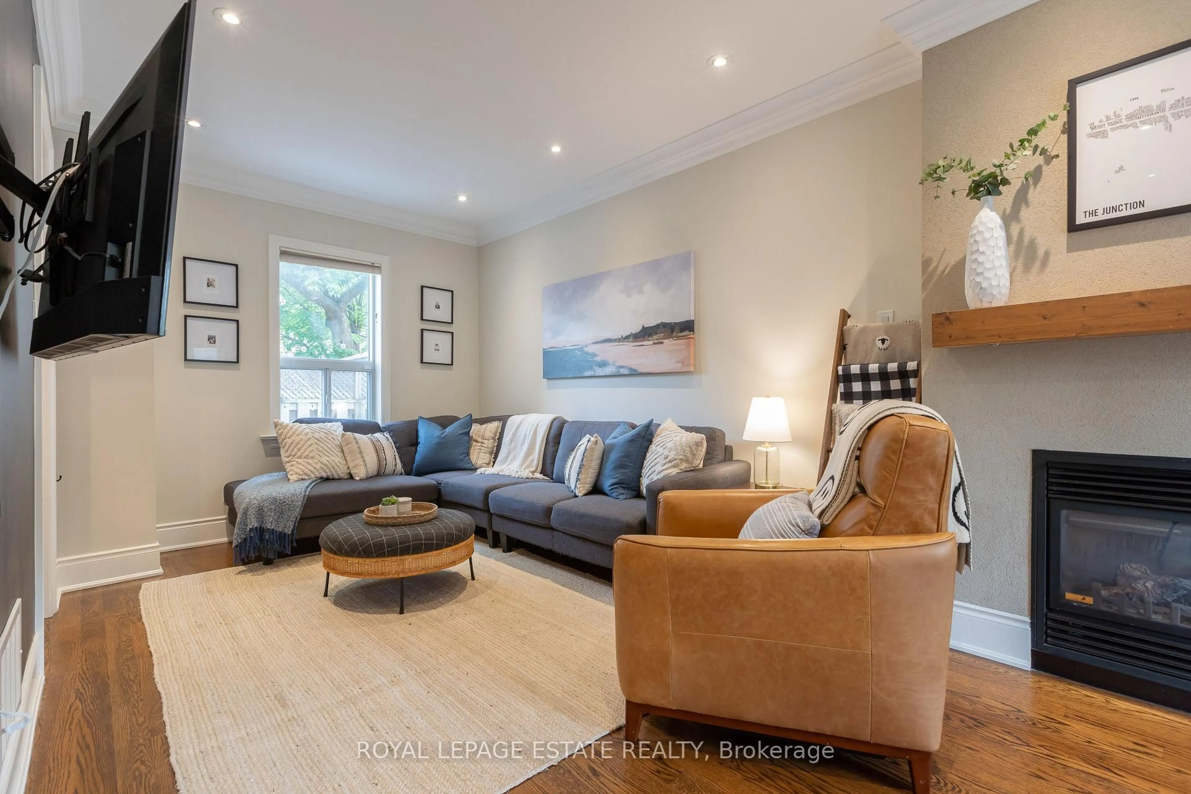 Living room with furniture, wood/laminate floor for 24 Maher Ave, Toronto Ontario M6P 1S6