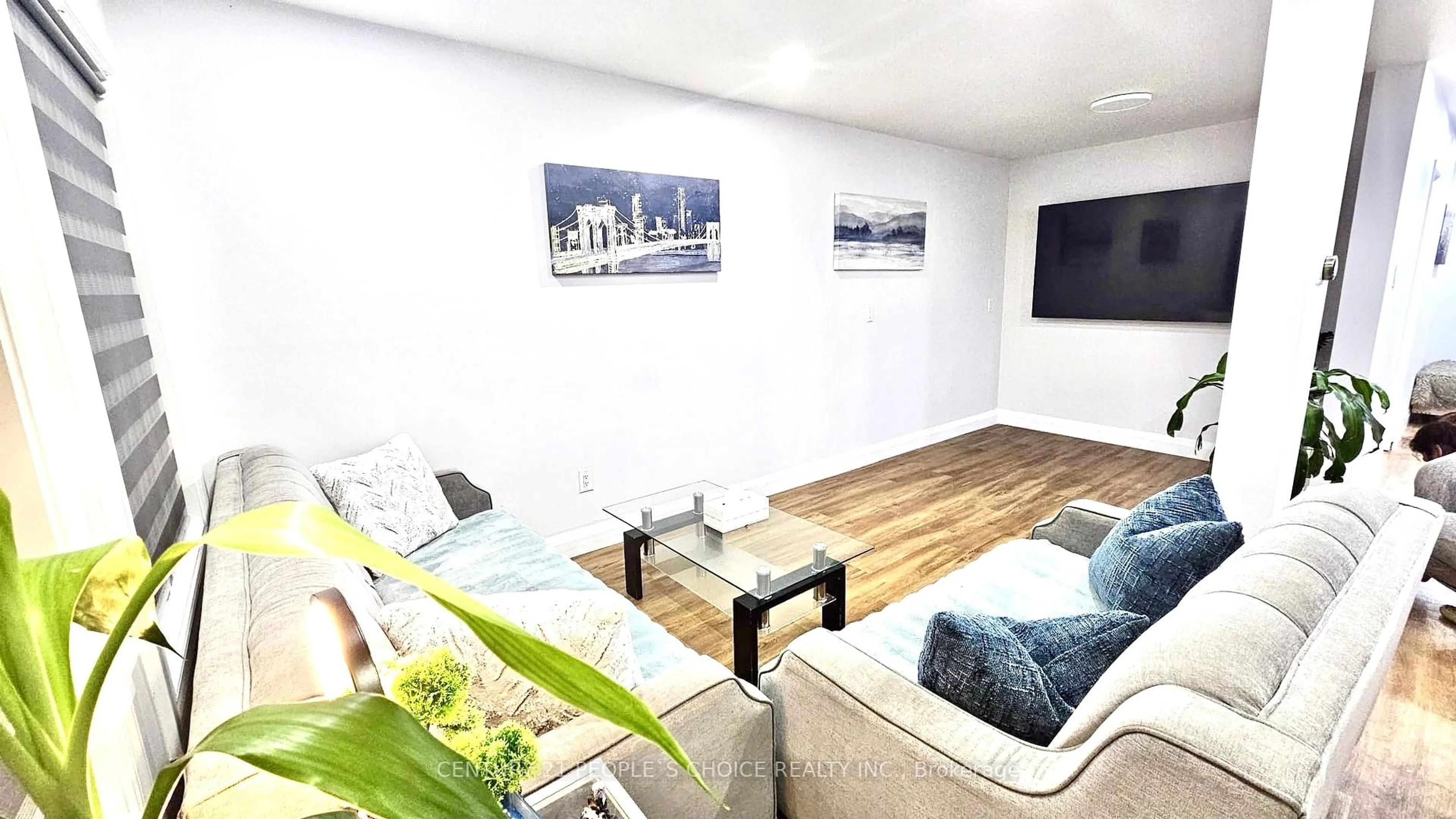 Living room with furniture, wood/laminate floor for 116 Goldenlight Circ, Brampton Ontario L6X 4N6