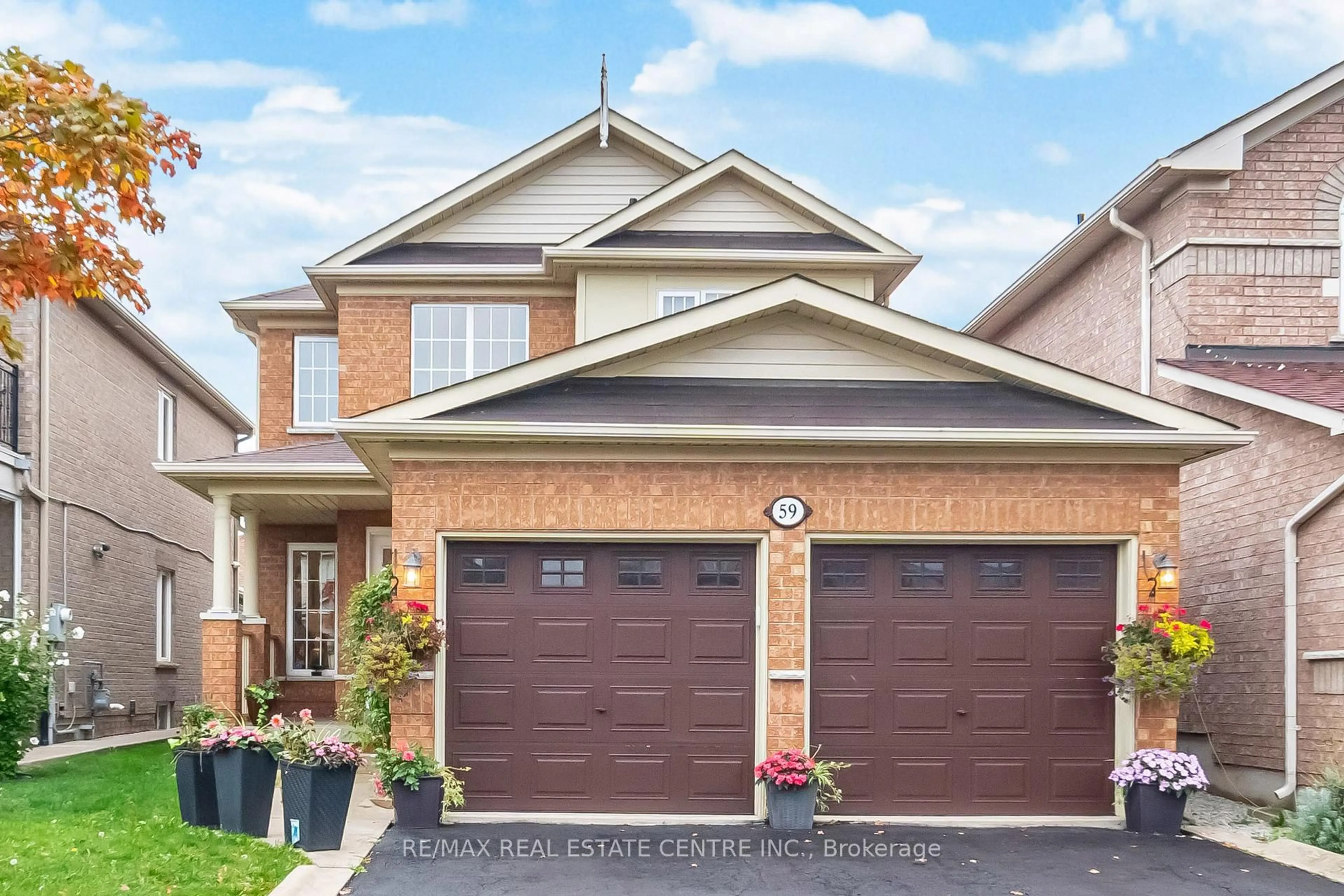 Home with brick exterior material, street for 59 Vintage Gate, Brampton Ontario L6X 5C3