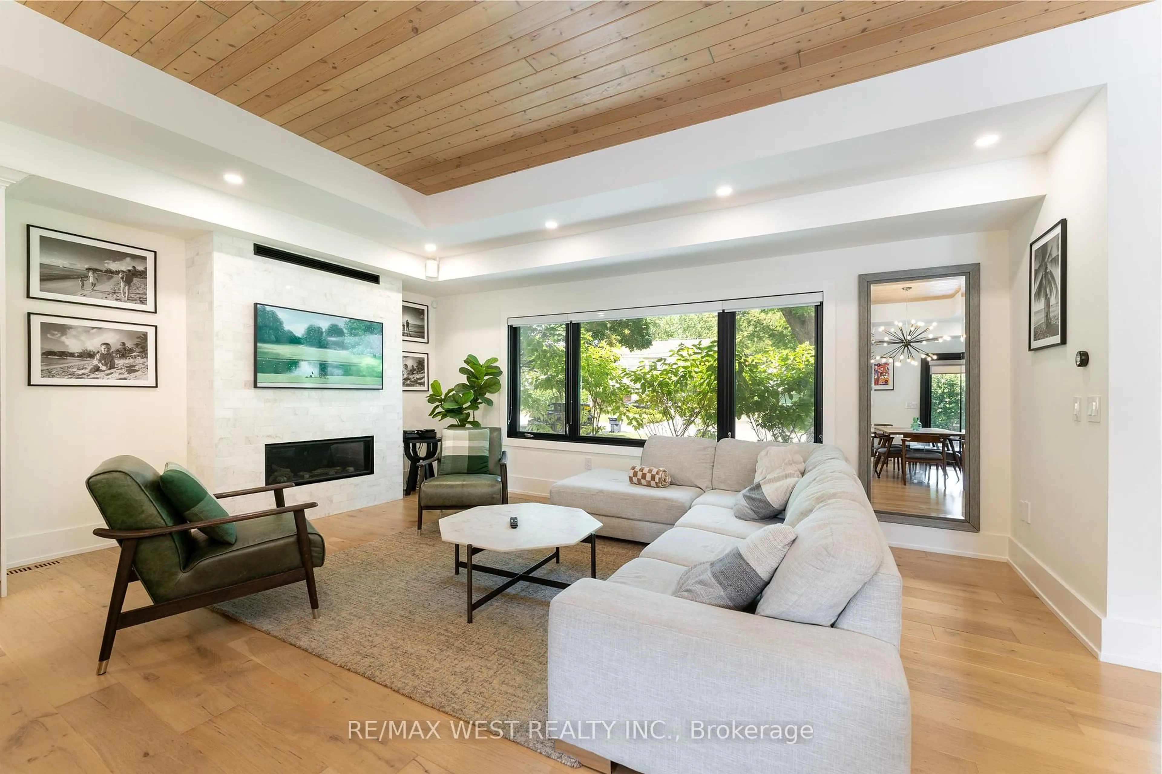 Living room with furniture, wood/laminate floor for 92 Warwood Rd, Toronto Ontario M9B 5B7