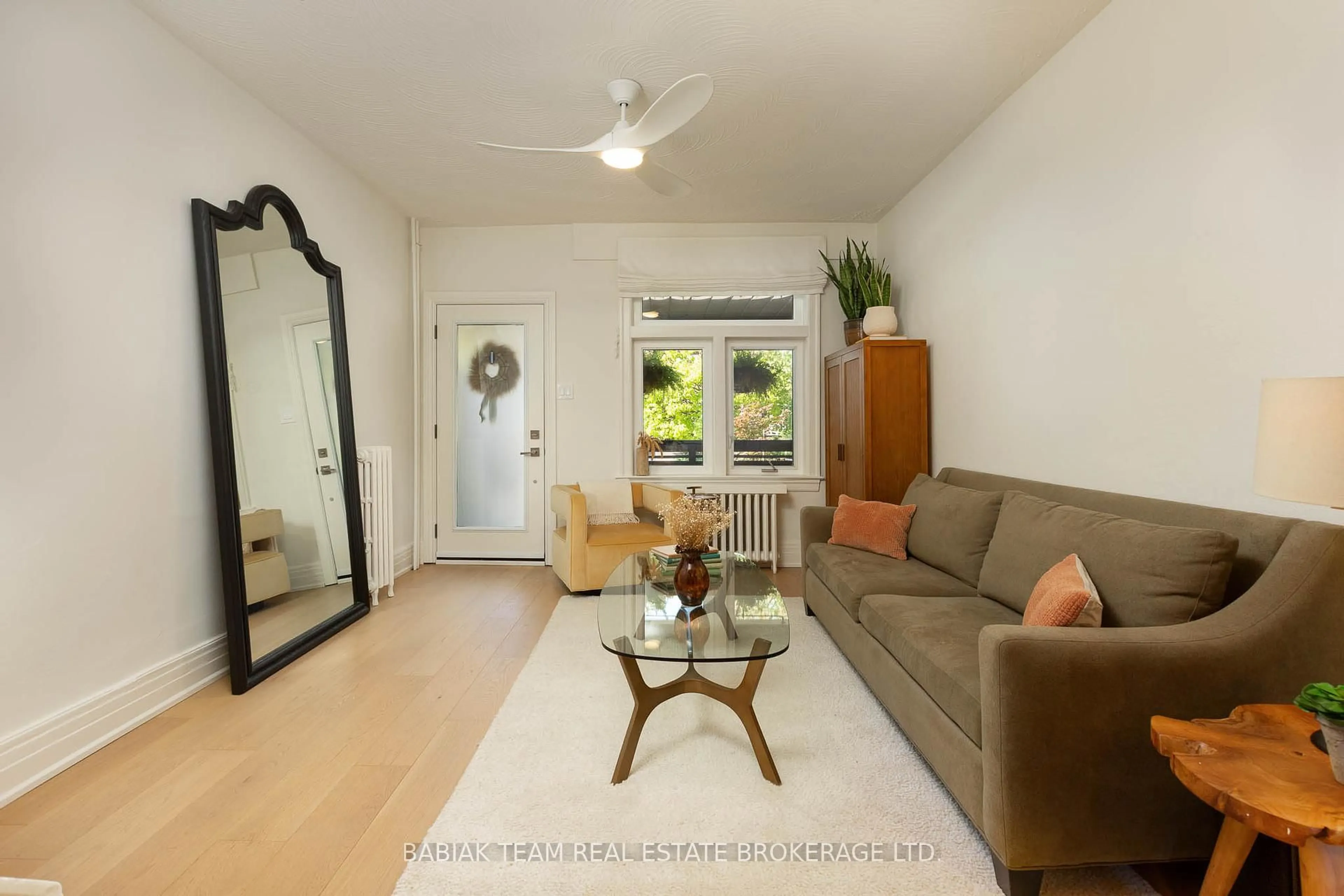 Living room with furniture, wood/laminate floor for 85 Watson Ave, Toronto Ontario M6S 4E2