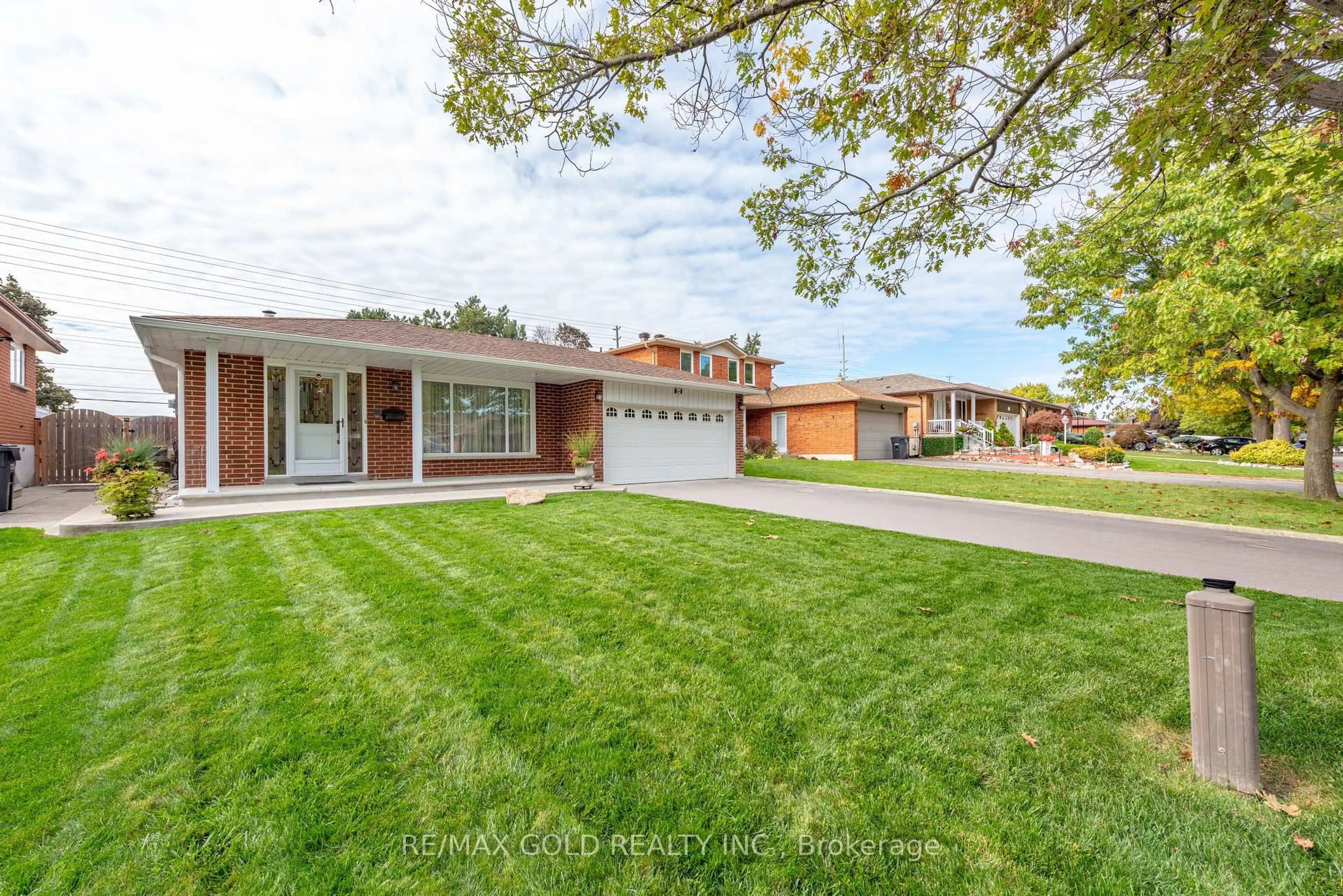 Home with brick exterior material, street for 64 Malcolm Cres, Brampton Ontario L6S 3C8