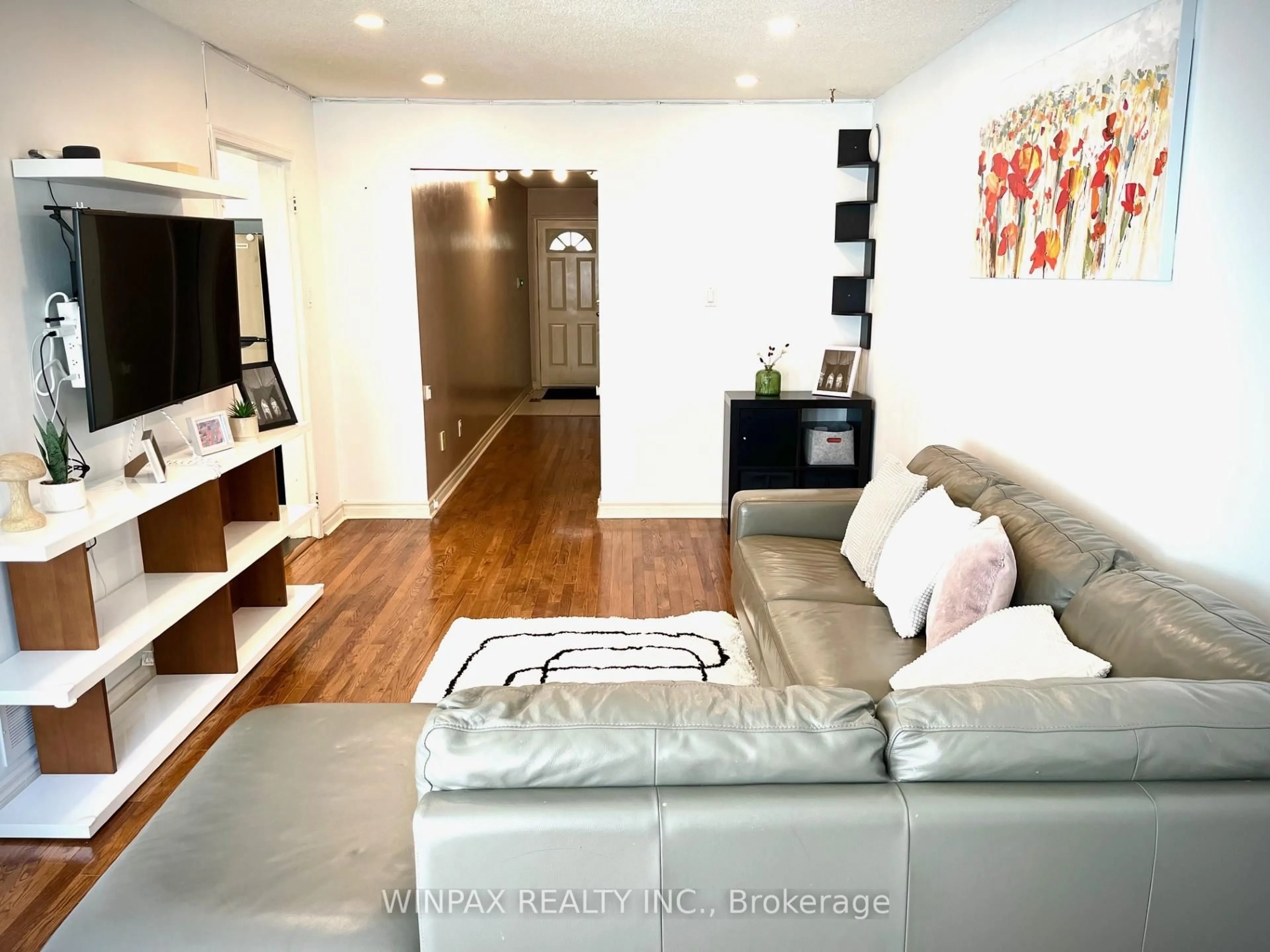 Living room with furniture, wood/laminate floor for 800 Constellation Dr #13, Mississauga Ontario L5R 3L6
