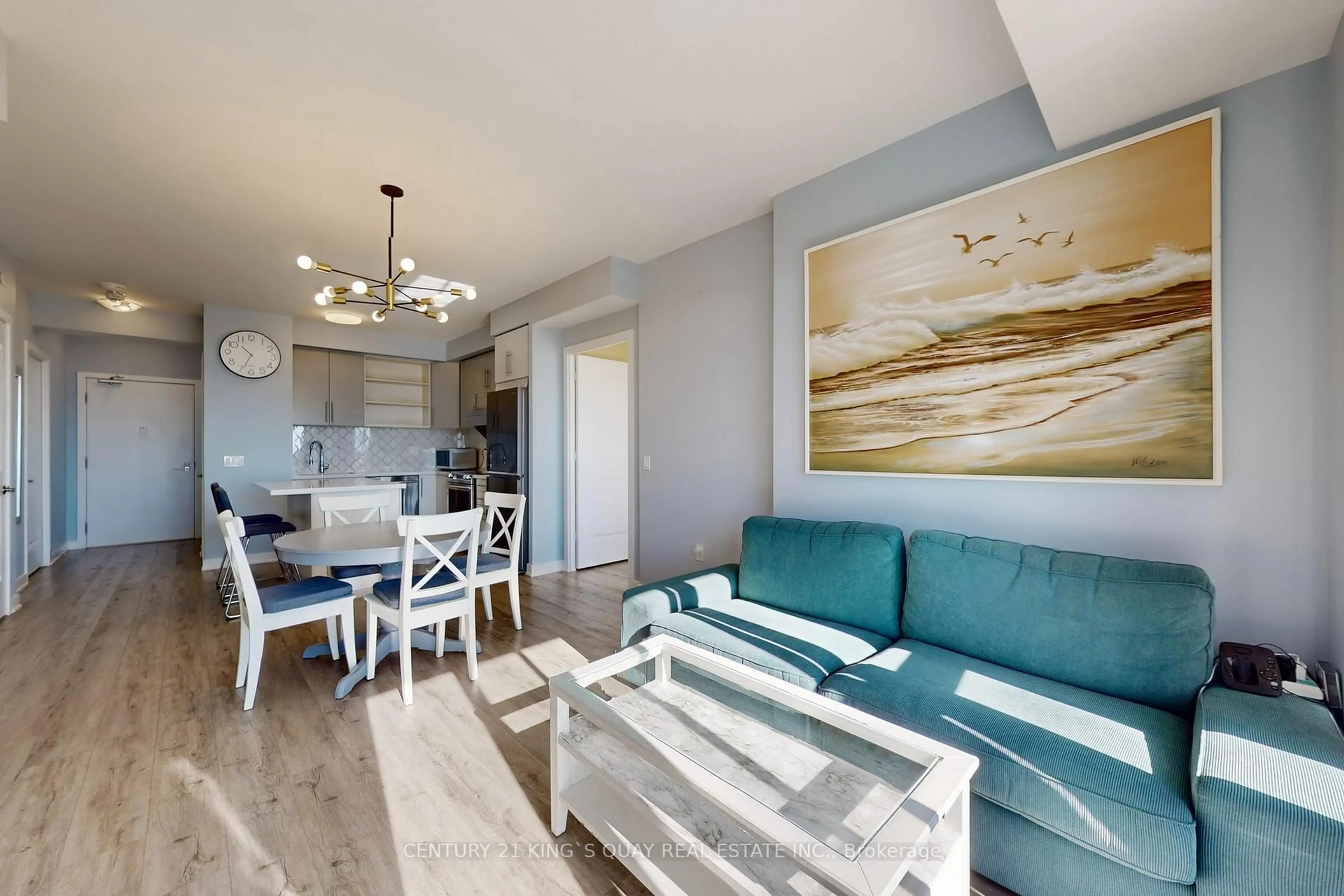 Living room with furniture, wood/laminate floor for 4677 Glen Erin Dr #705, Mississauga Ontario L5M 2E3