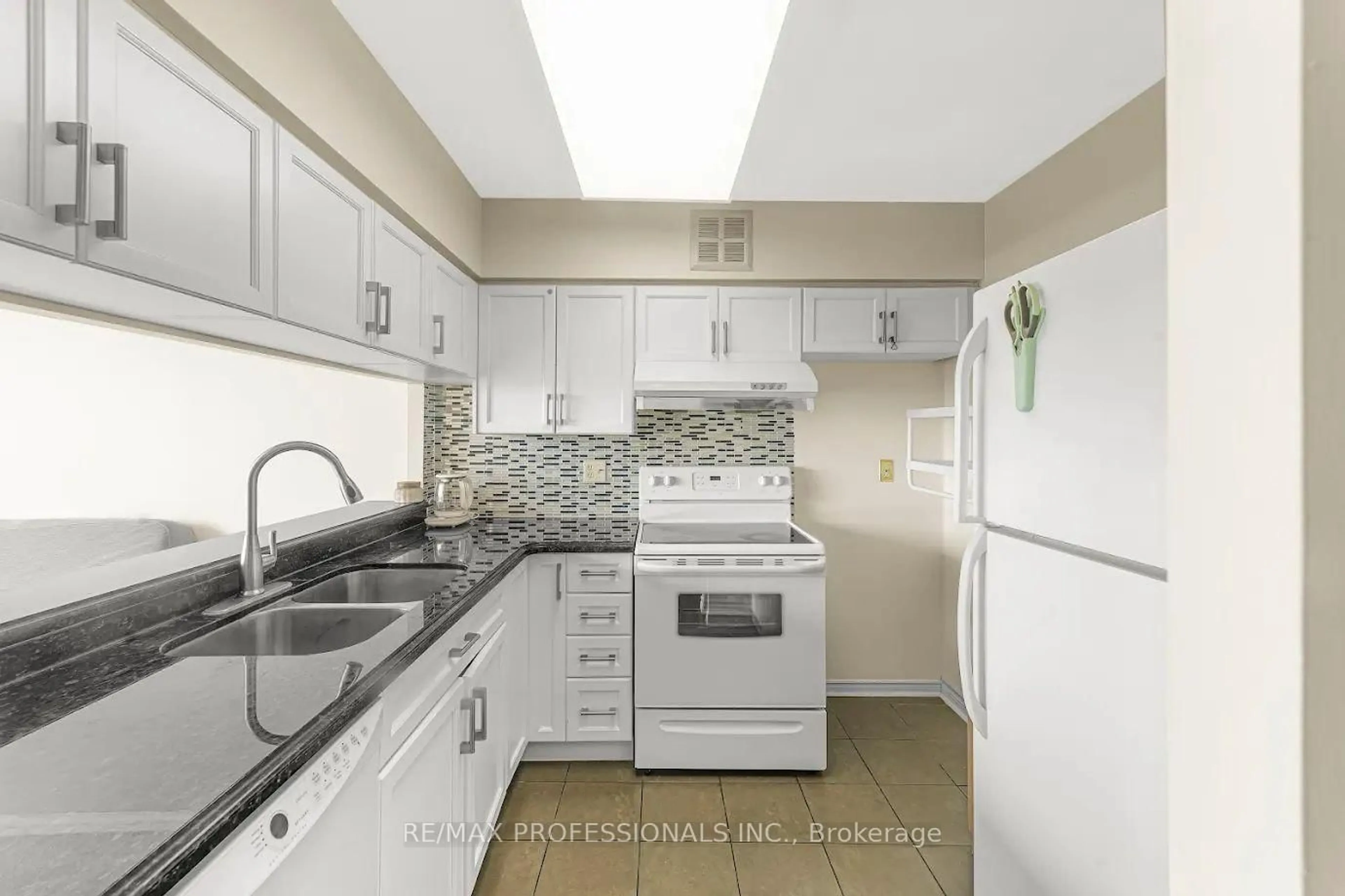 Standard kitchen, ceramic/tile floor for 50 Kingsbridge Garden Circ #1502, Mississauga Ontario L5R 1Y2
