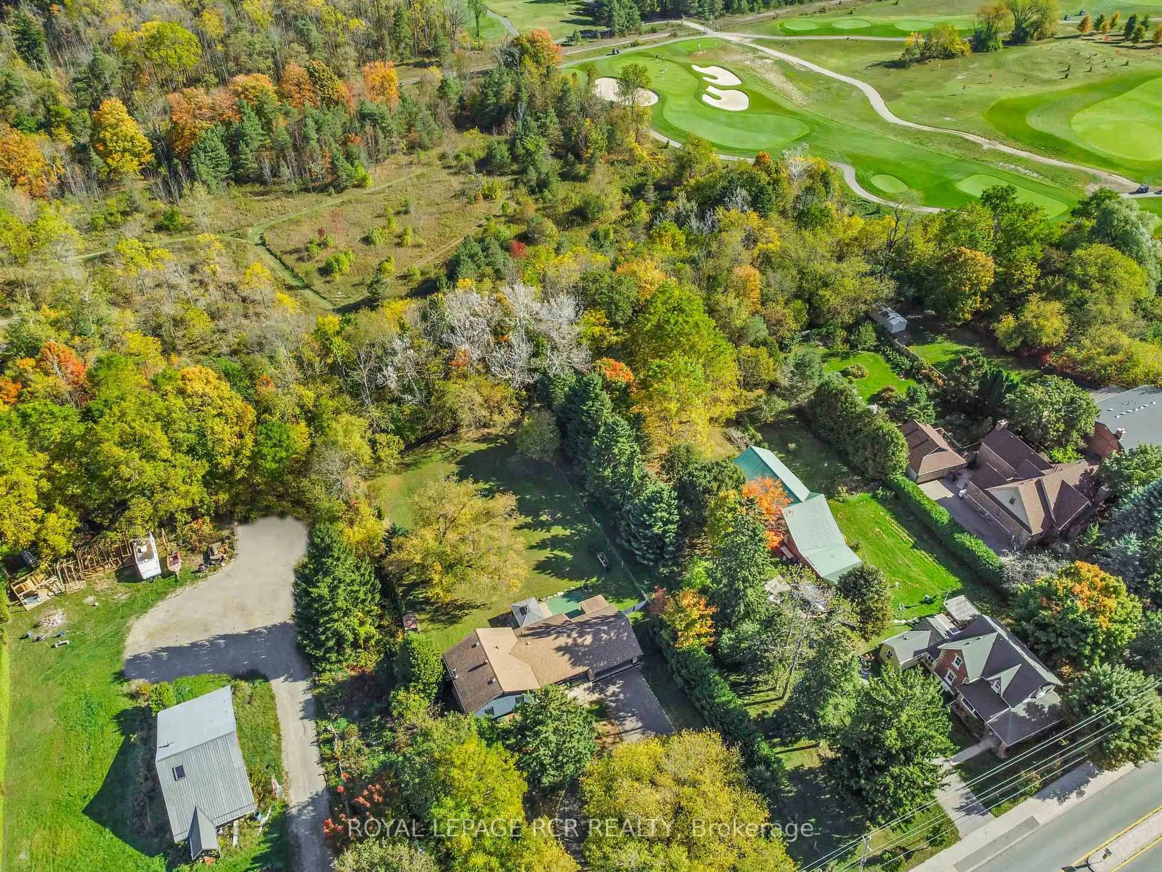 A pic from outside/outdoor area/front of a property/back of a property/a pic from drone, forest/trees view for 19619 Main St, Caledon Ontario L7K 0E1