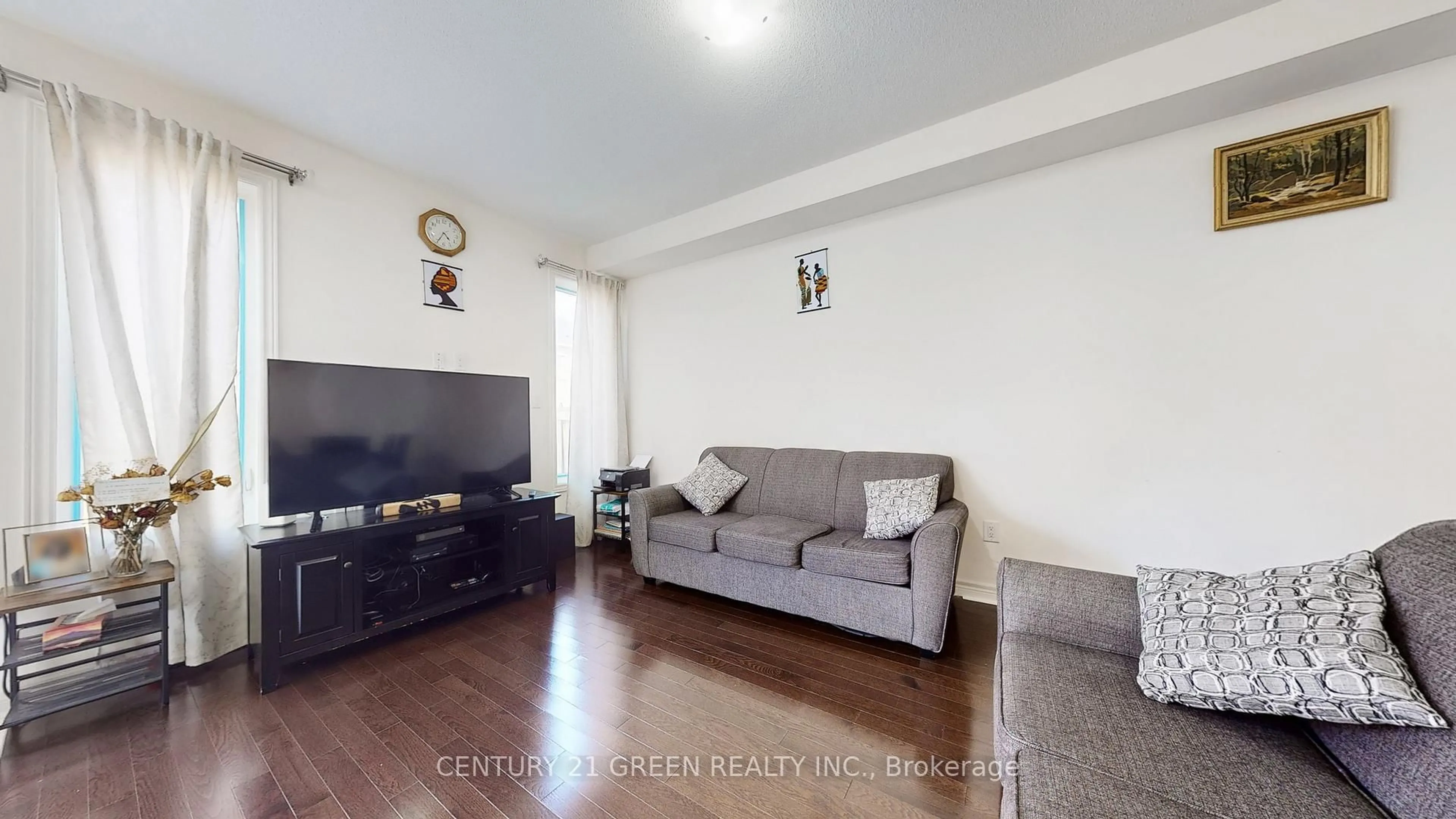 Living room with furniture, wood/laminate floor for 30 Canary Clse, Brampton Ontario L6X 5L1