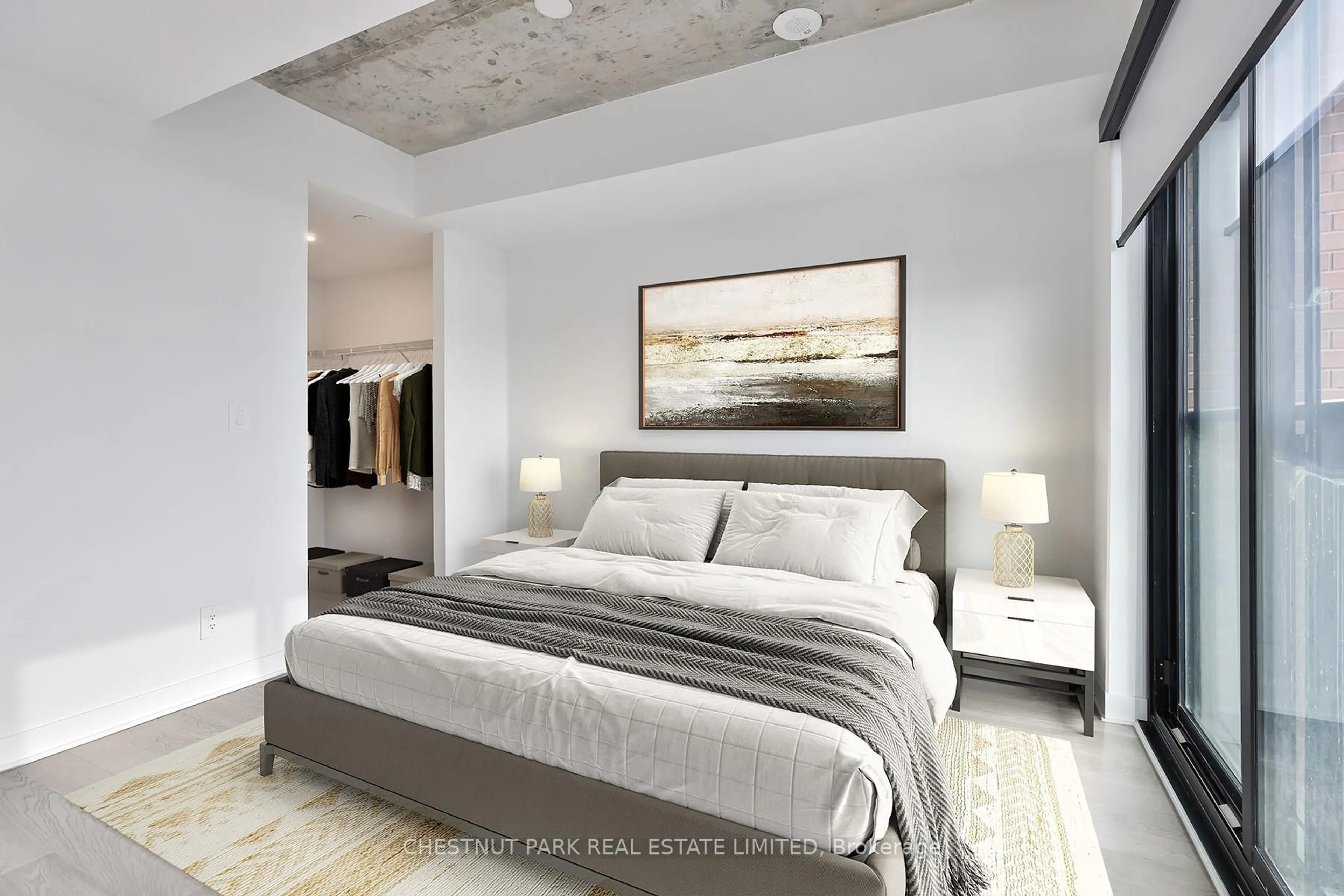 Bedroom with bed, cement floor for 2720 Dundas St #508, Toronto Ontario M6P 1Y2