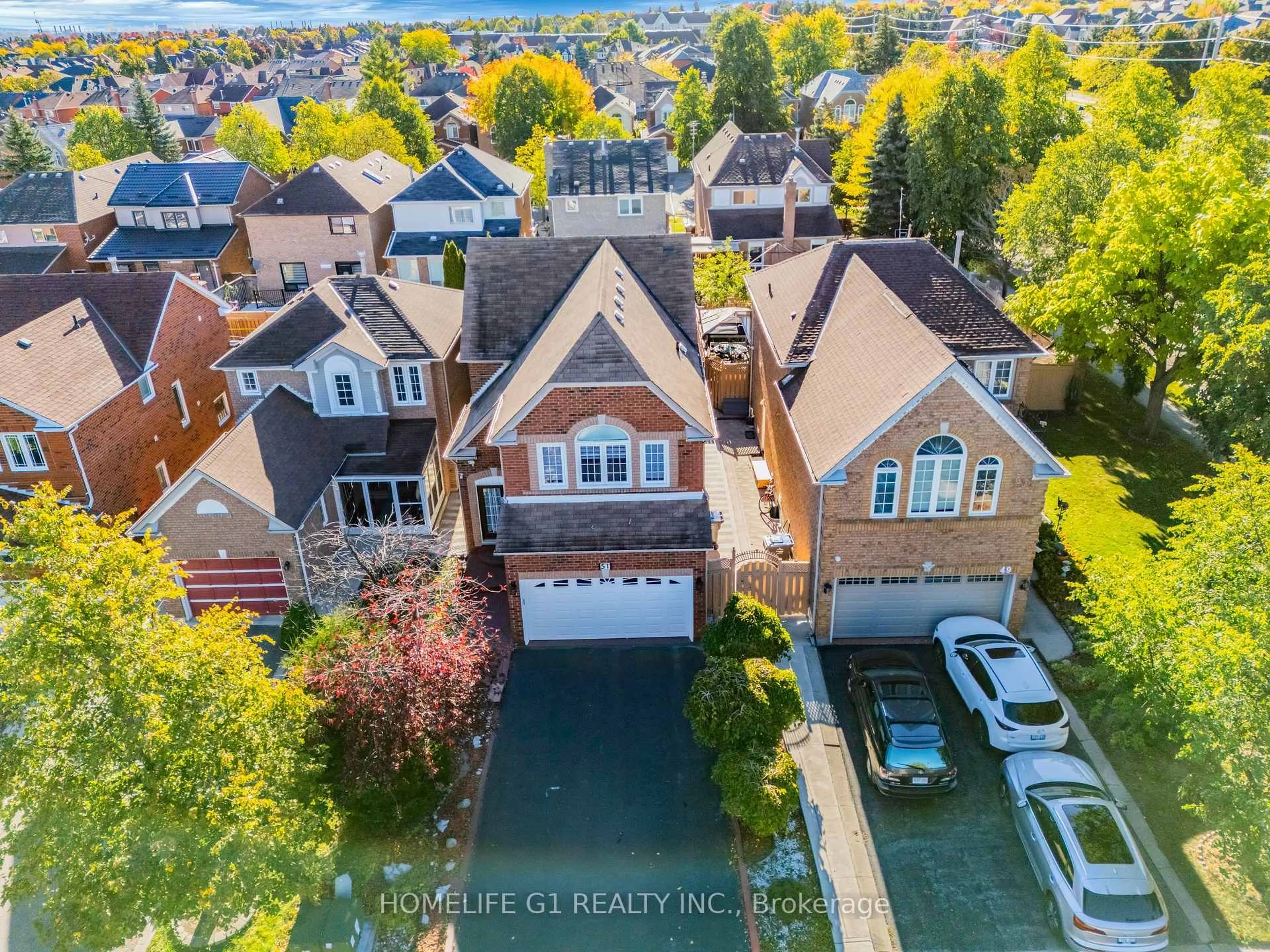 A pic from outside/outdoor area/front of a property/back of a property/a pic from drone, water/lake/river/ocean view for 51 Rocky Mountain Cres, Brampton Ontario L6R 1E7