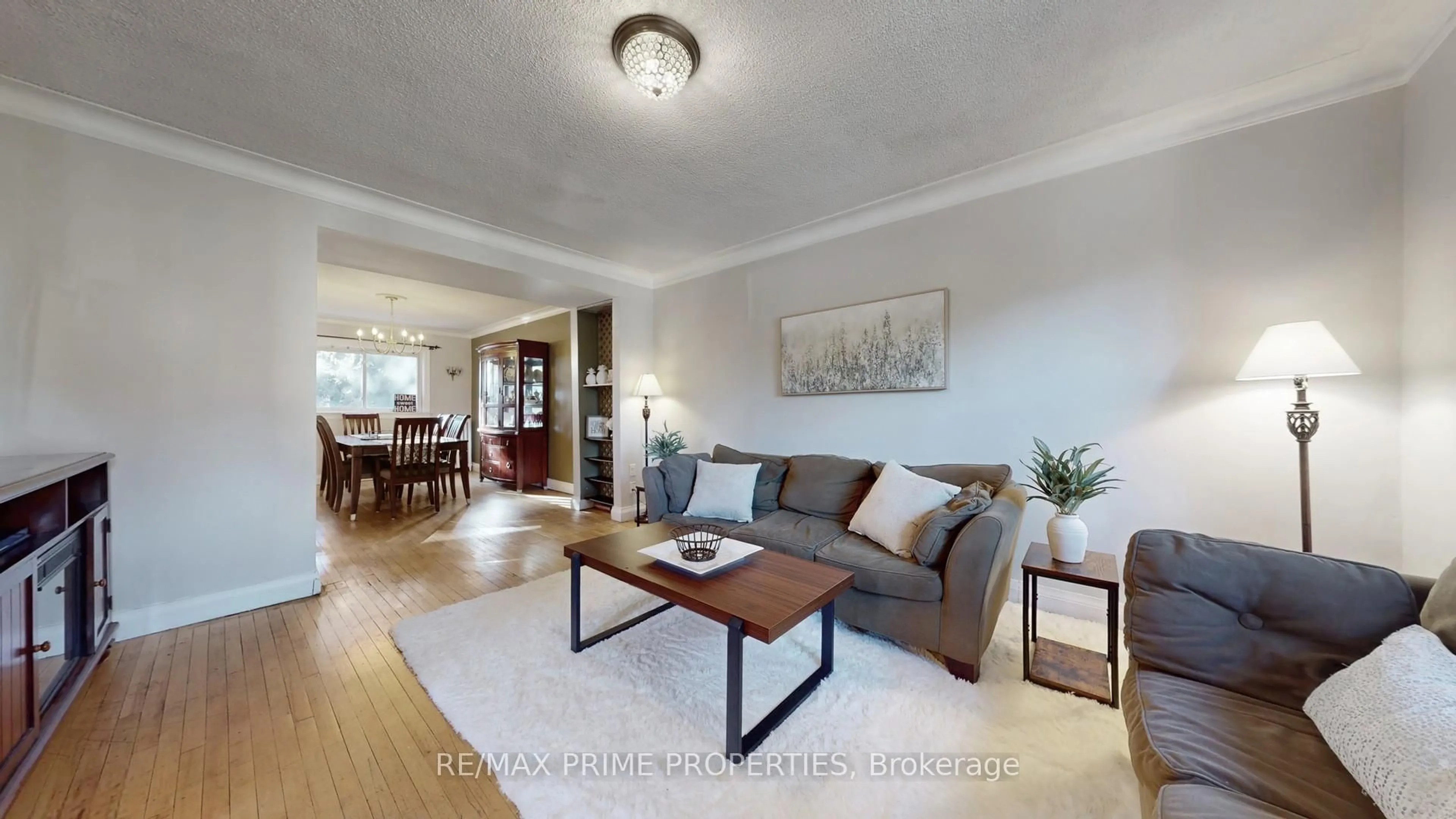Living room with furniture, wood/laminate floor for 664 Durie St, Toronto Ontario M6S 3H3