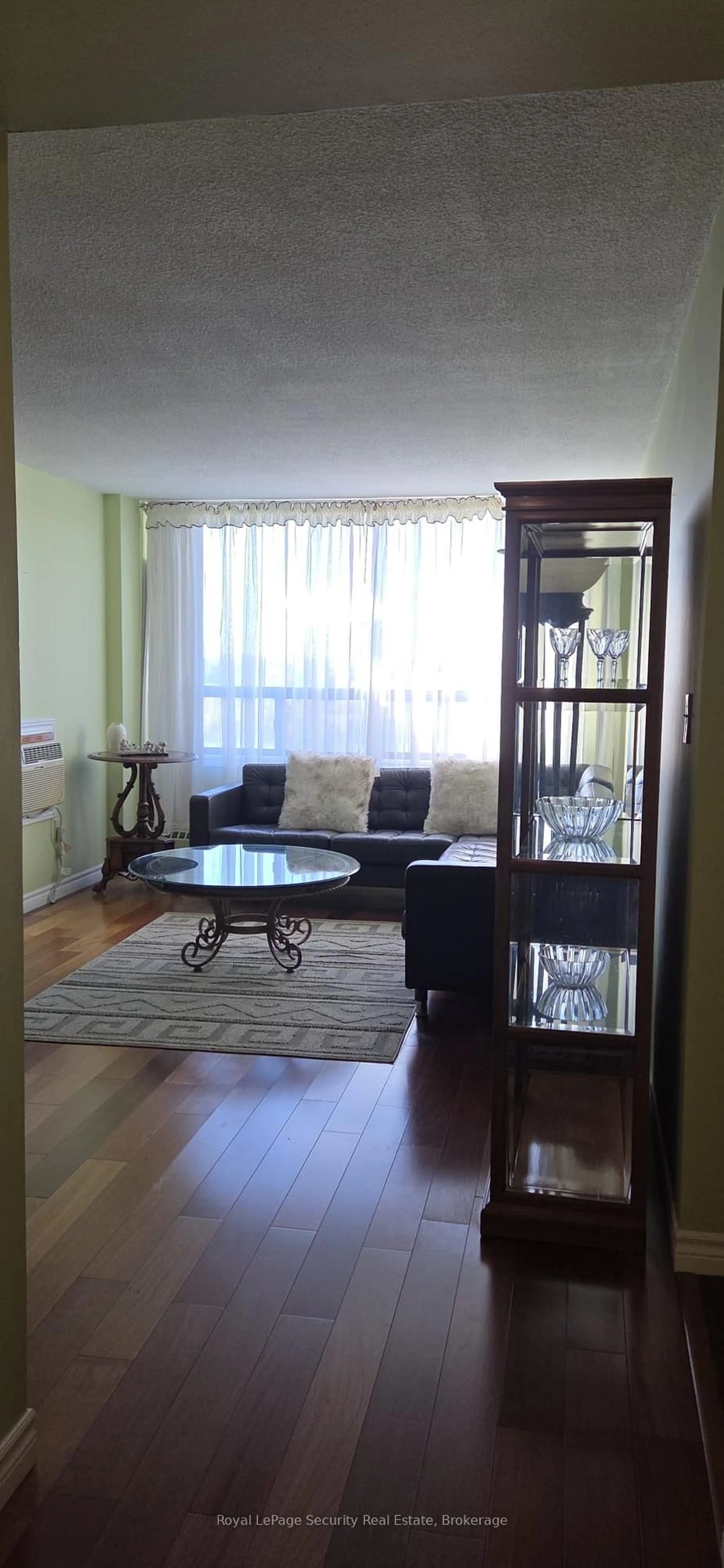 Living room with furniture, wood/laminate floor for 2556 Argyle Rd #805, Mississauga Ontario L5B 2H6