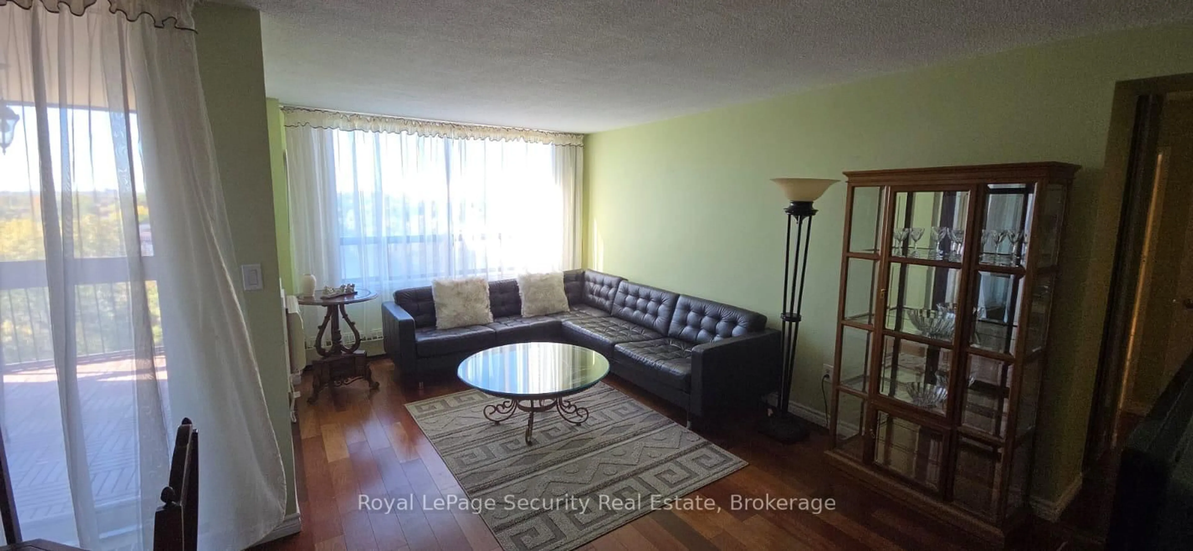 Living room with furniture, wood/laminate floor for 2556 Argyle Rd #805, Mississauga Ontario L5B 2H6