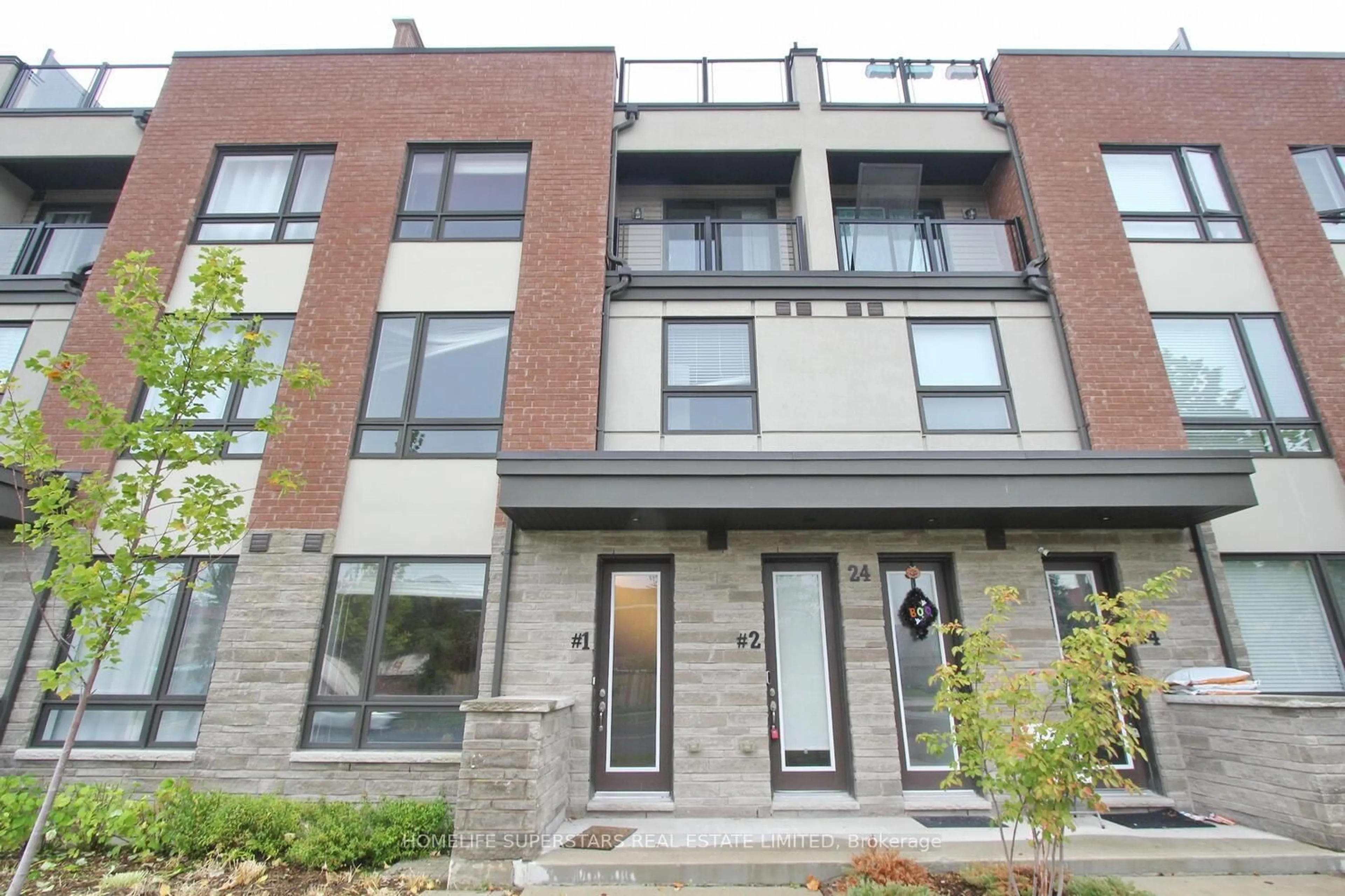 Home with brick exterior material, street for 24 Humberwood Blvd #1, Toronto Ontario M9W 0G1