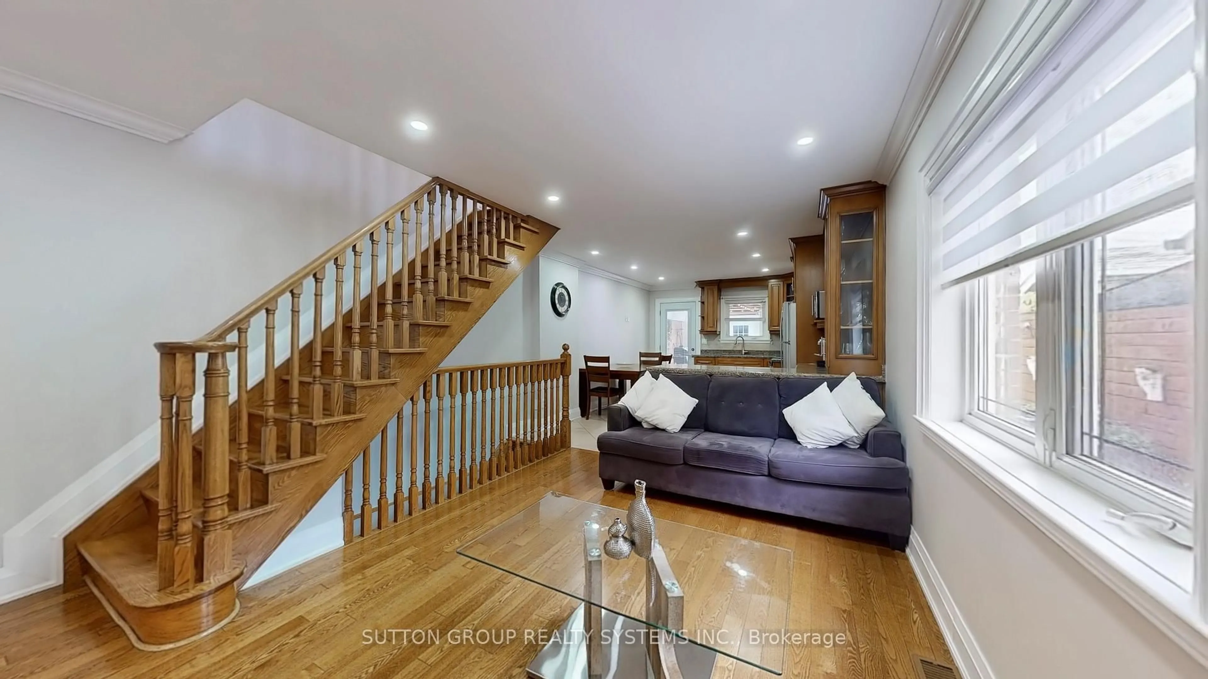Living room with furniture, wood/laminate floor for 24 Chambers Ave, Toronto Ontario M6N 3L9