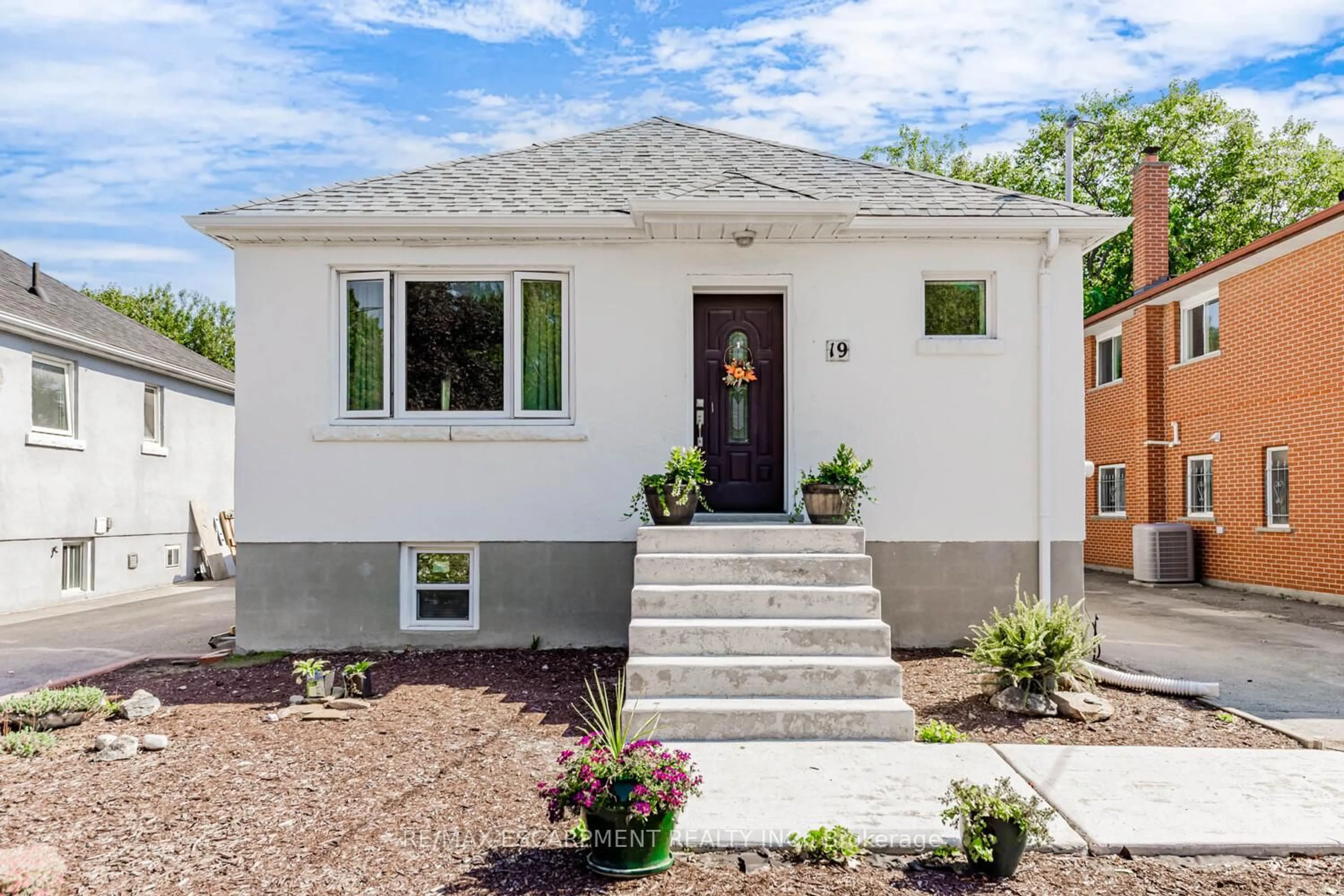 Home with brick exterior material, street for 19 Stock Ave, Toronto Ontario M8Z 5C3