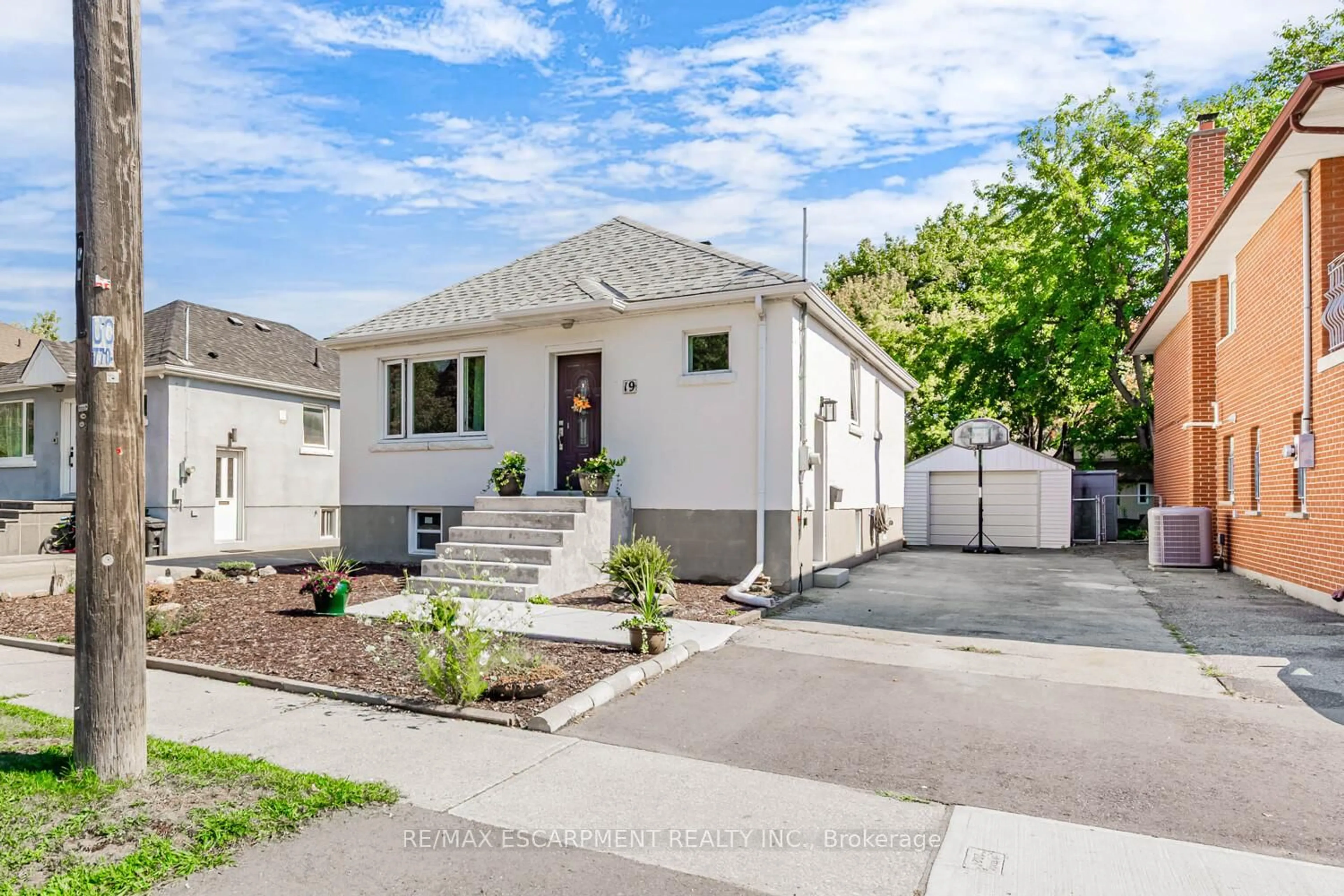 Home with vinyl exterior material, street for 19 Stock Ave, Toronto Ontario M8Z 5C3