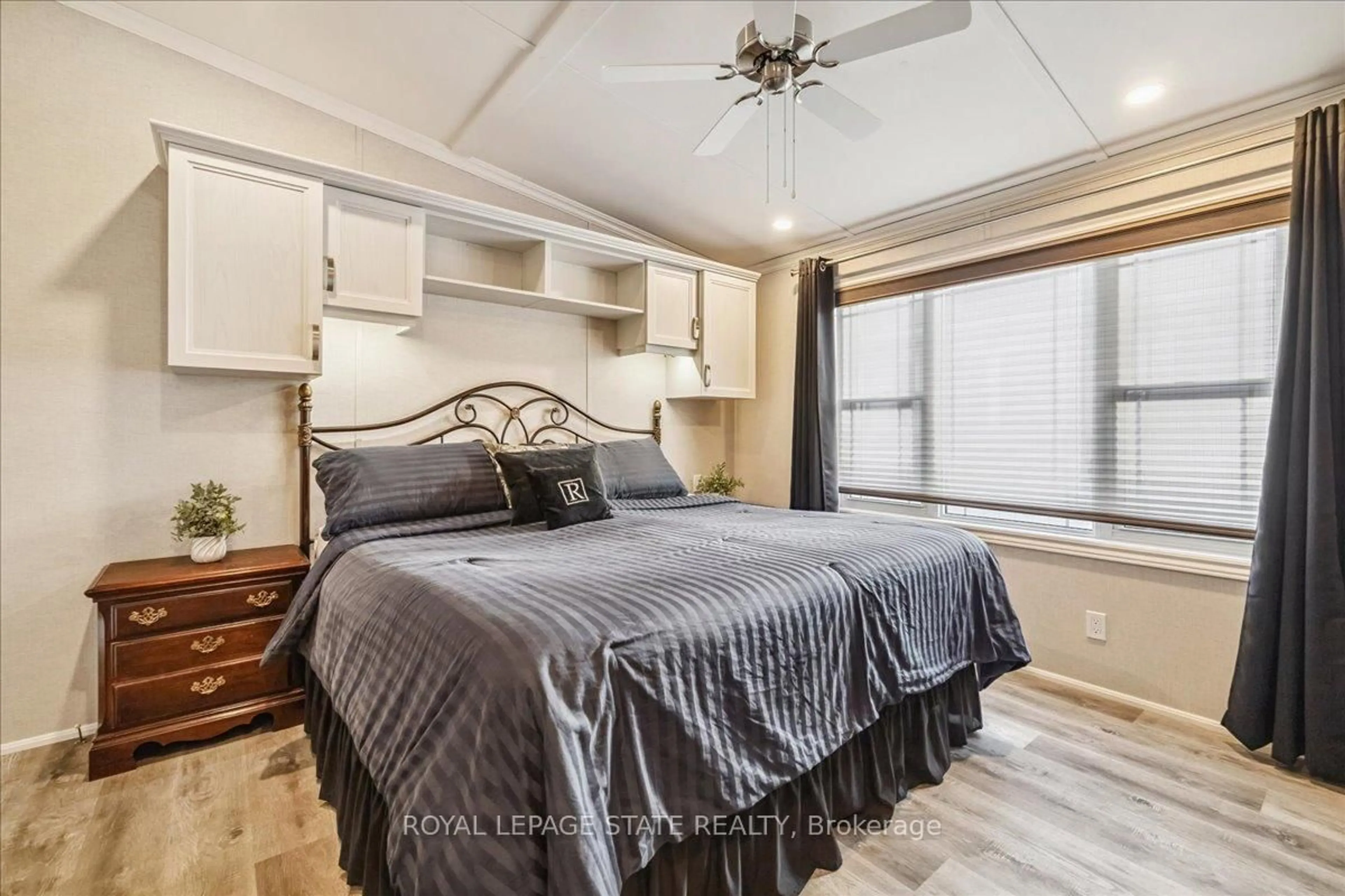 Bedroom with bed, wood/laminate floor for 4449 Milburough Line #37 Ash, Burlington Ontario L7P 0C5