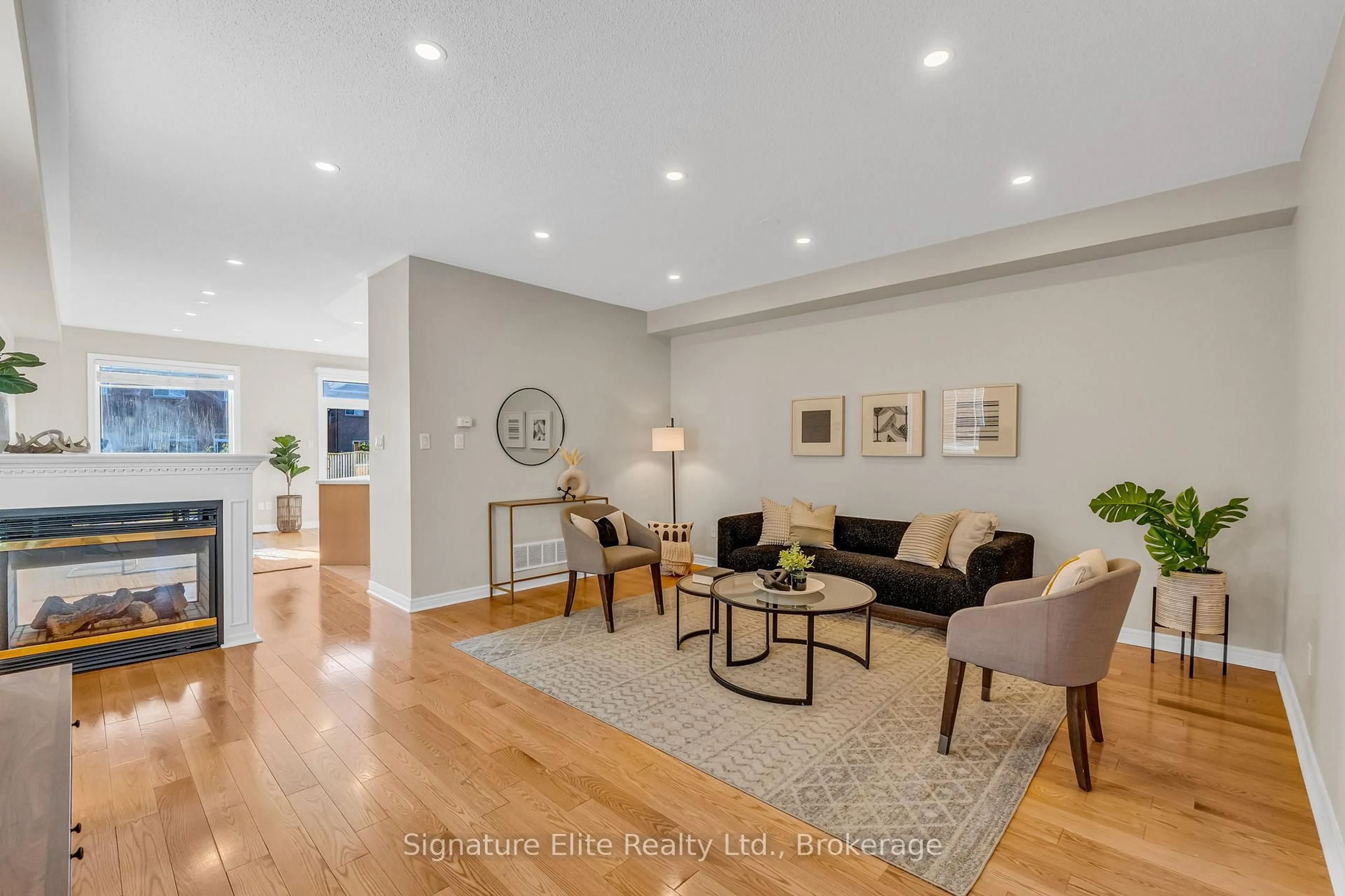 Living room with furniture, wood/laminate floor for 124 Rocky Point Cres, Brampton Ontario L6V 4S6