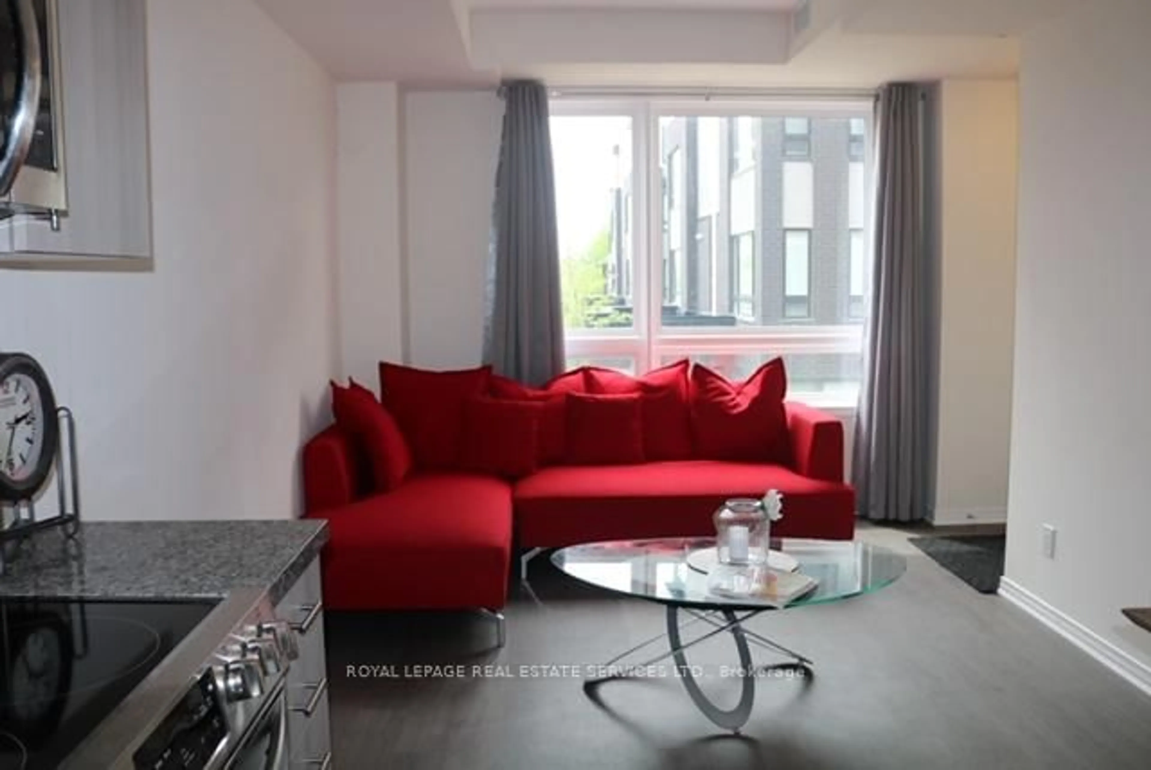 Living room with furniture, unknown for 1100 Briar Hill Ave #204, Toronto Ontario M6B 1M7