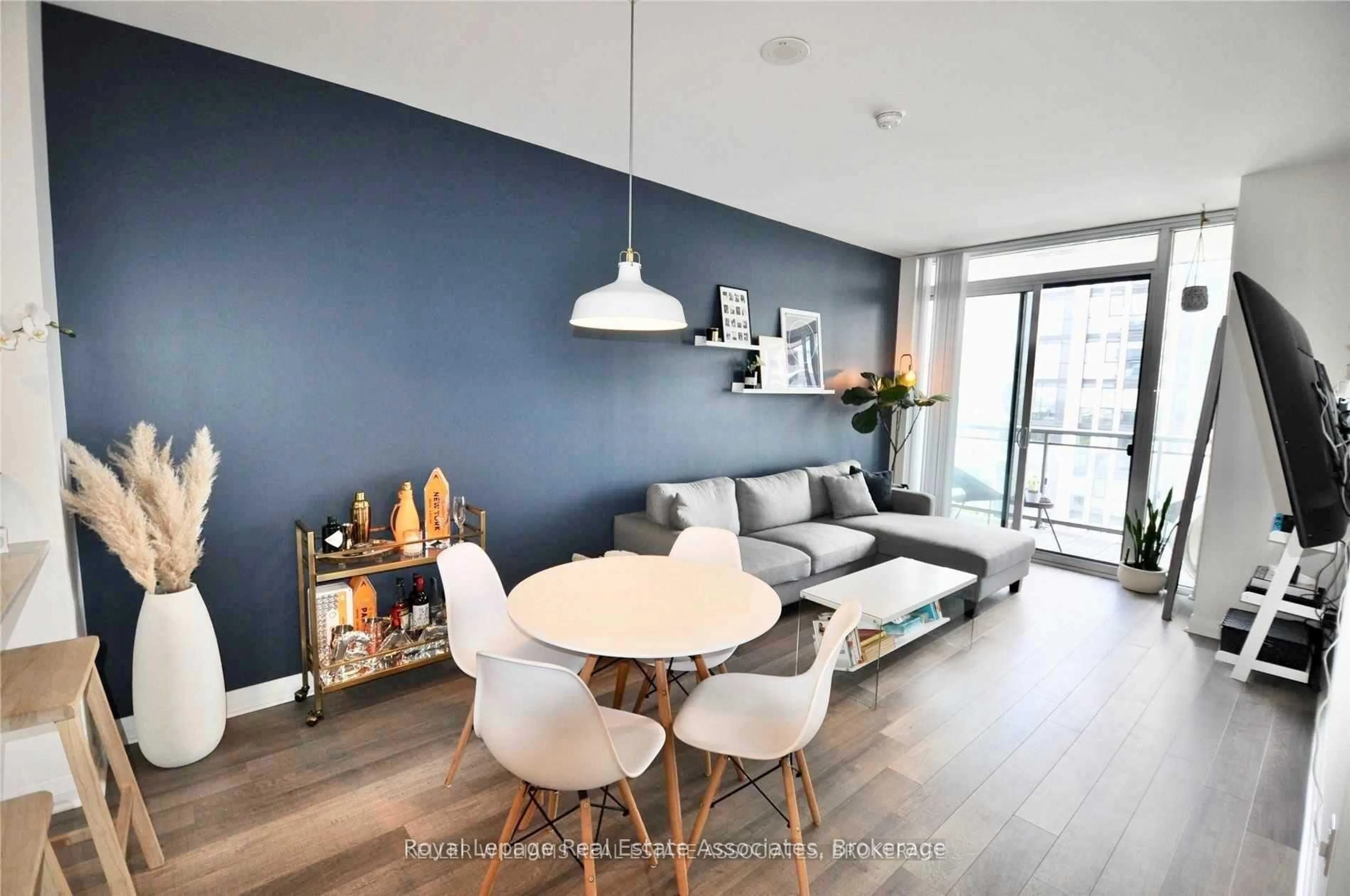 Living room with furniture, wood/laminate floor for 5033 Four Springs Ave #1416, Mississauga Ontario L5R 0G6