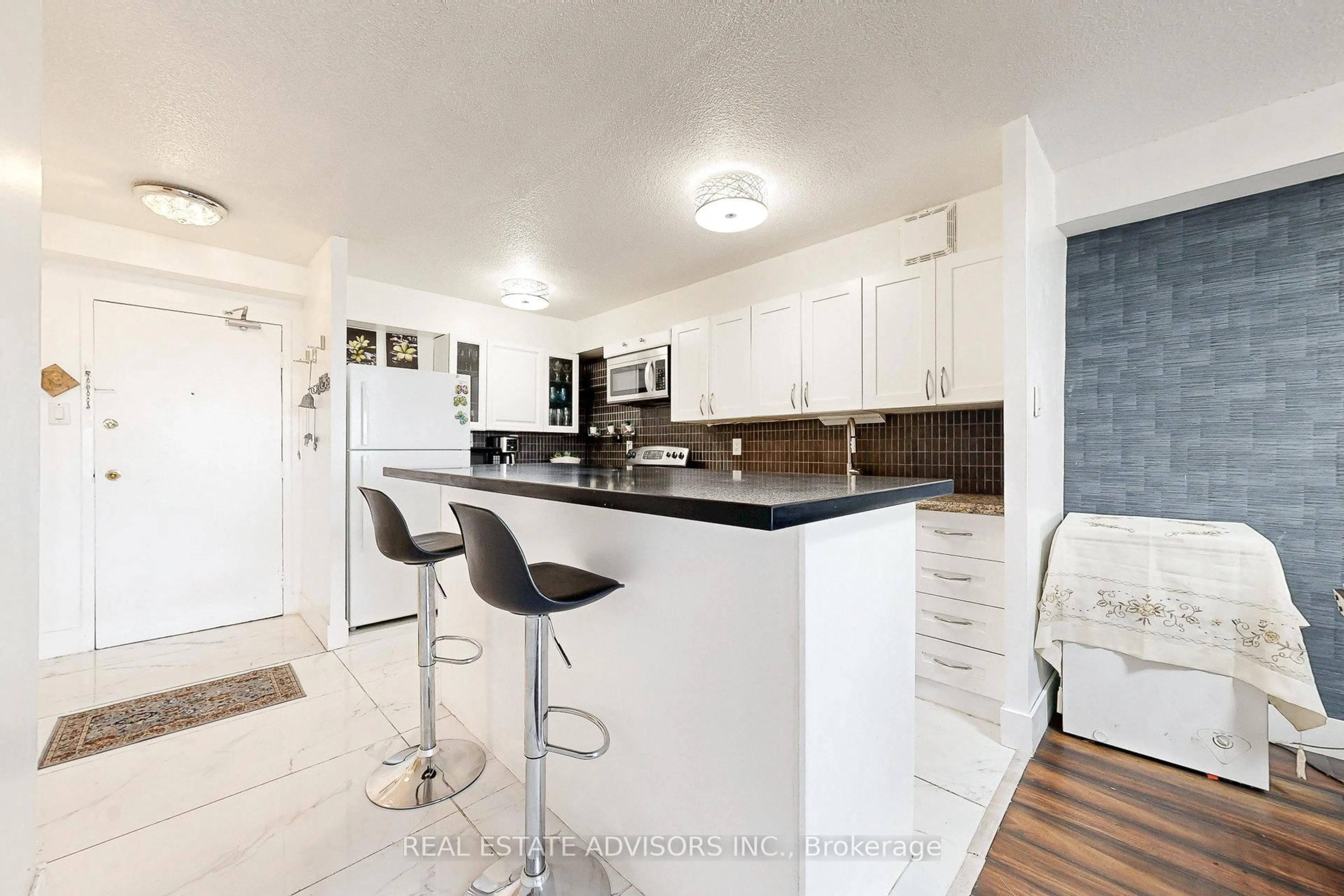 Open concept kitchen, ceramic/tile floor for 10 Tobermory Dr #705, Toronto Ontario M3N 2Y5