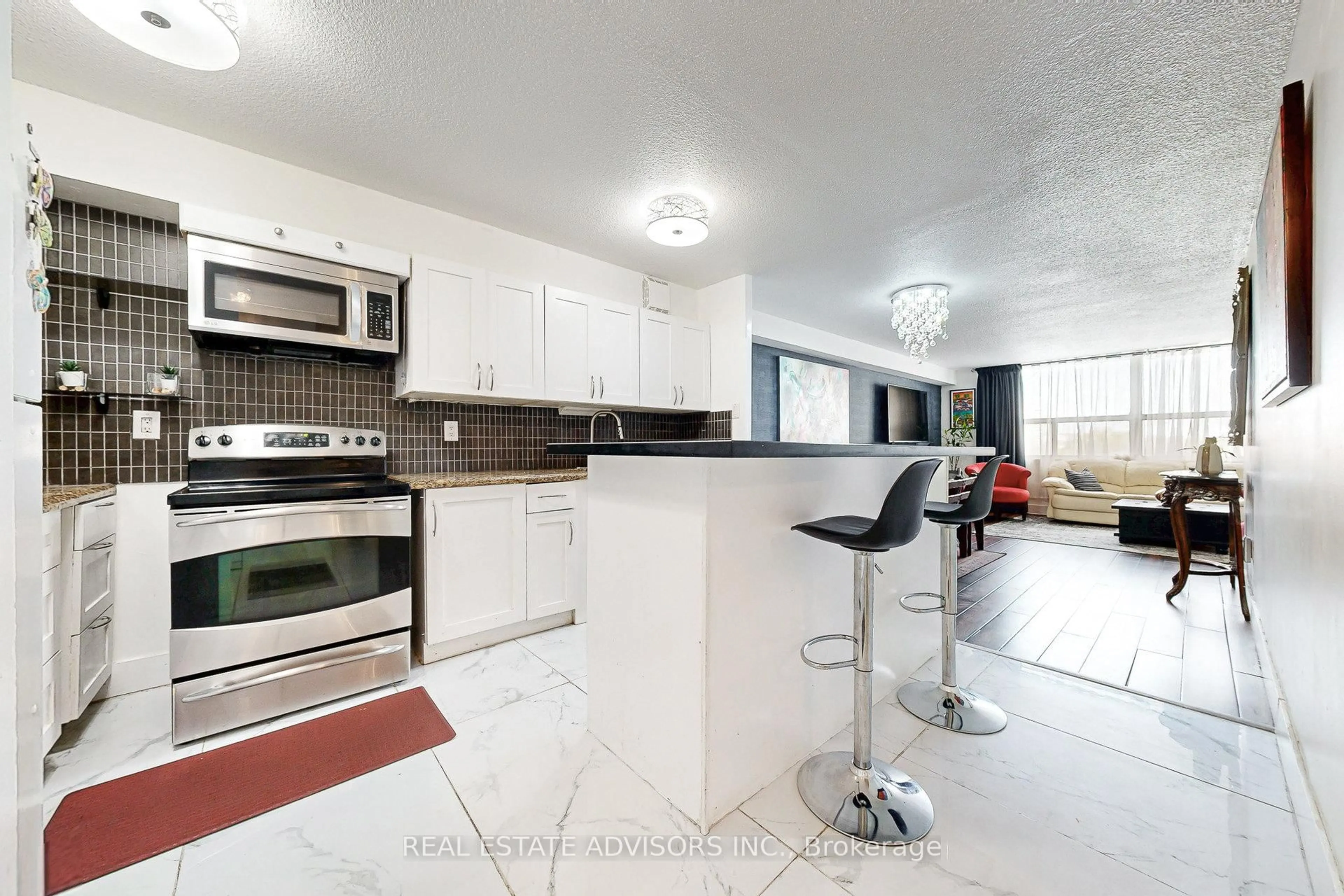 Open concept kitchen, ceramic/tile floor for 10 Tobermory Dr #705, Toronto Ontario M3N 2Y5