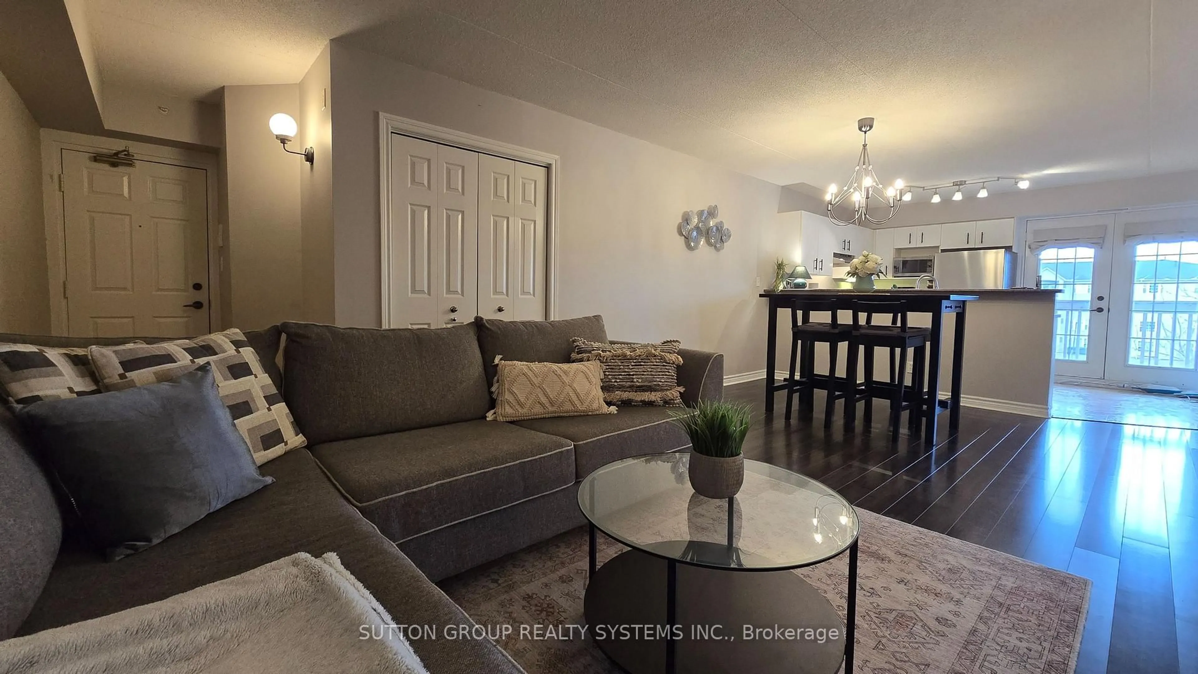 Living room with furniture, wood/laminate floor for 4005 Kilmer Dr #301, Burlington Ontario L7M 4M2