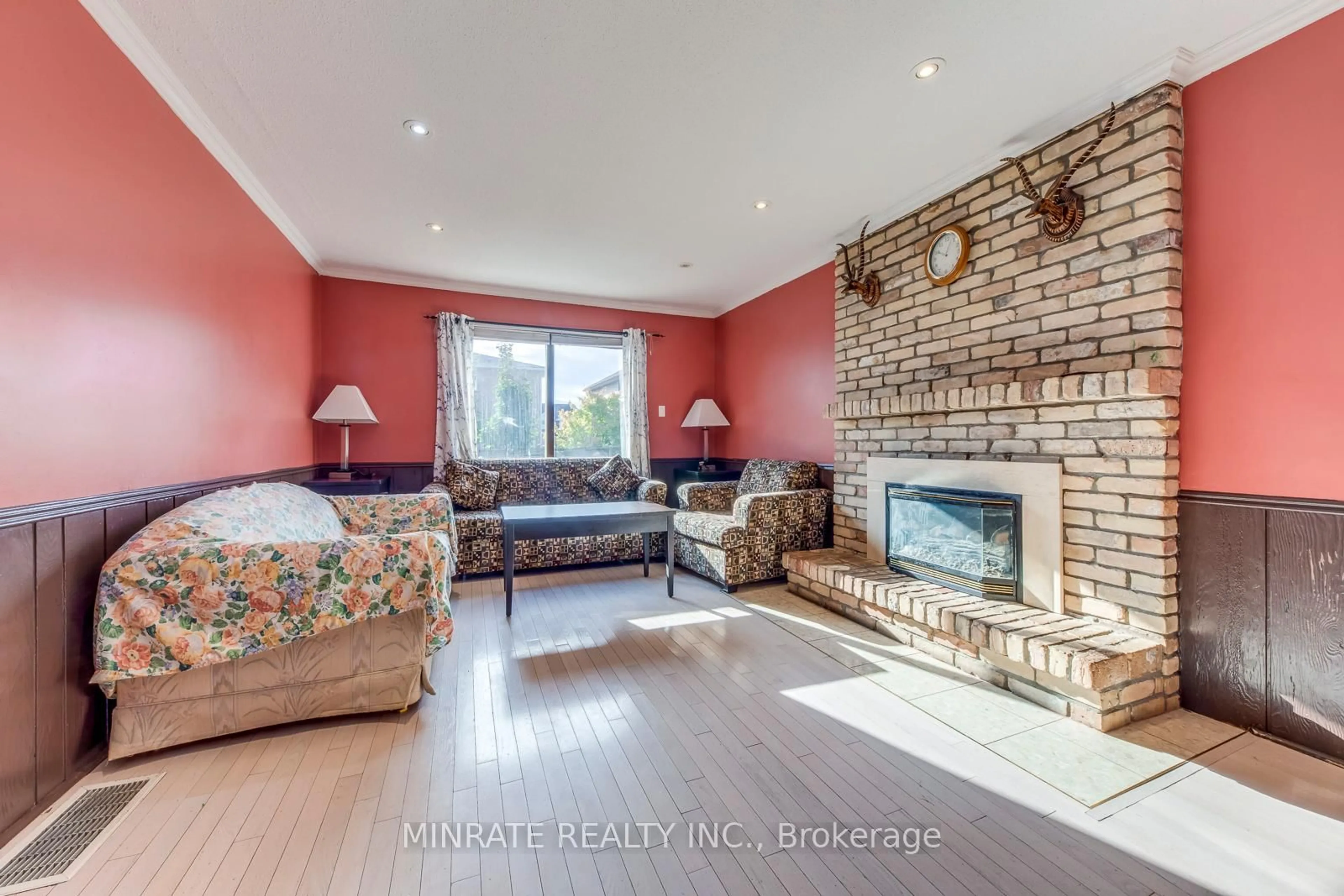 Living room with furniture, wood/laminate floor for 3346 Palmer Dr, Burlington Ontario L7M 1Y9
