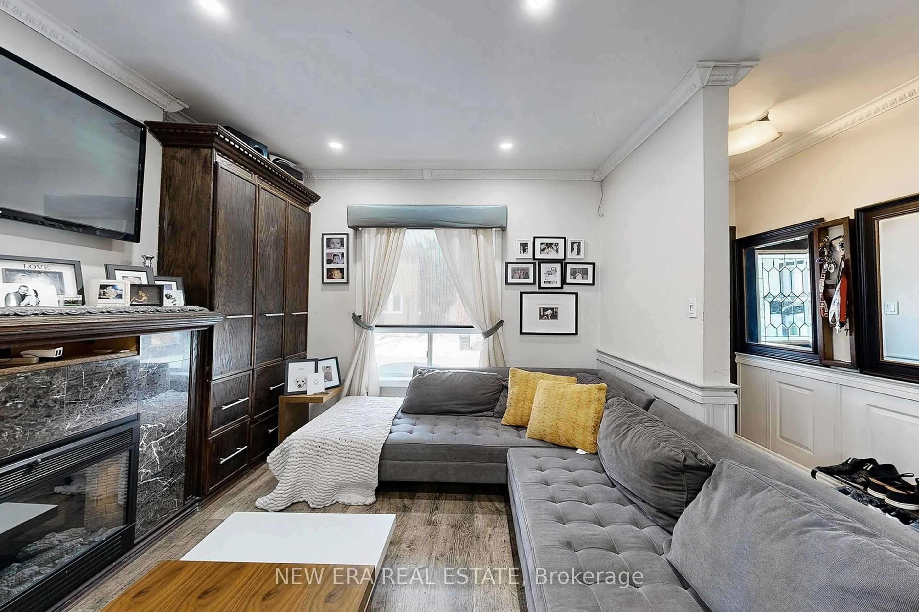Living room with furniture, wood/laminate floor for 53 Burnfield Ave, Toronto Ontario M6G 1Y4