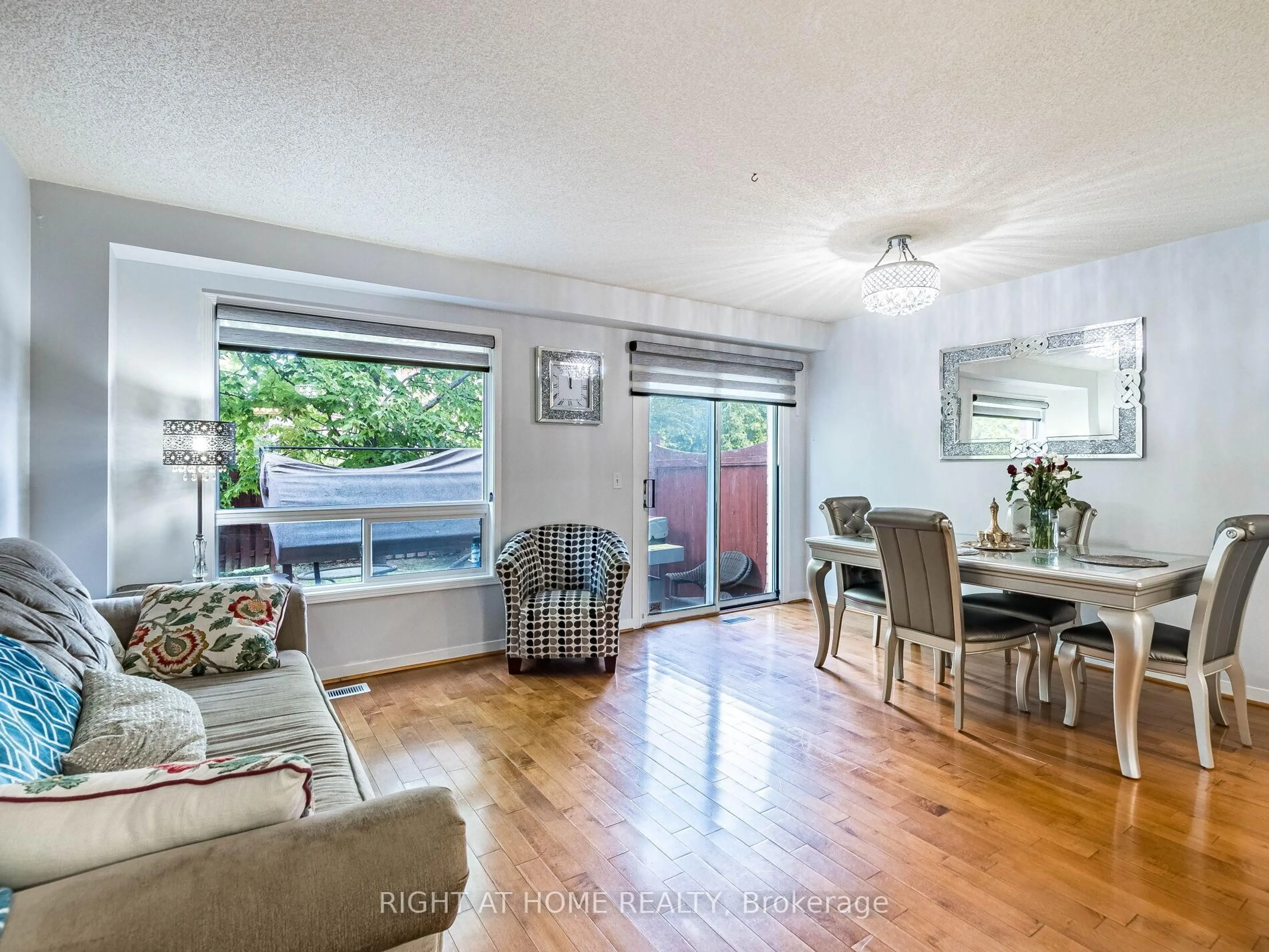 Living room with furniture, wood/laminate floor for 5030 Heatherleigh Ave #217, Mississauga Ontario L5V 2G7