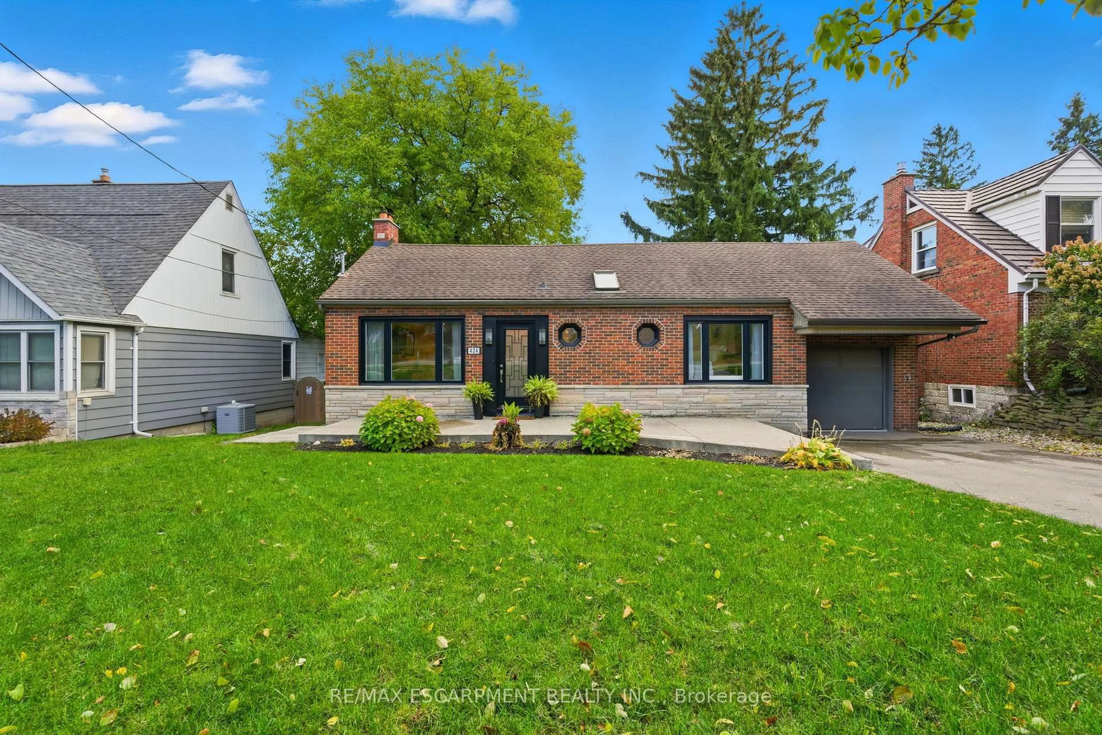 Home with brick exterior material, street for 424 Plains Rd, Burlington Ontario L7T 1G9