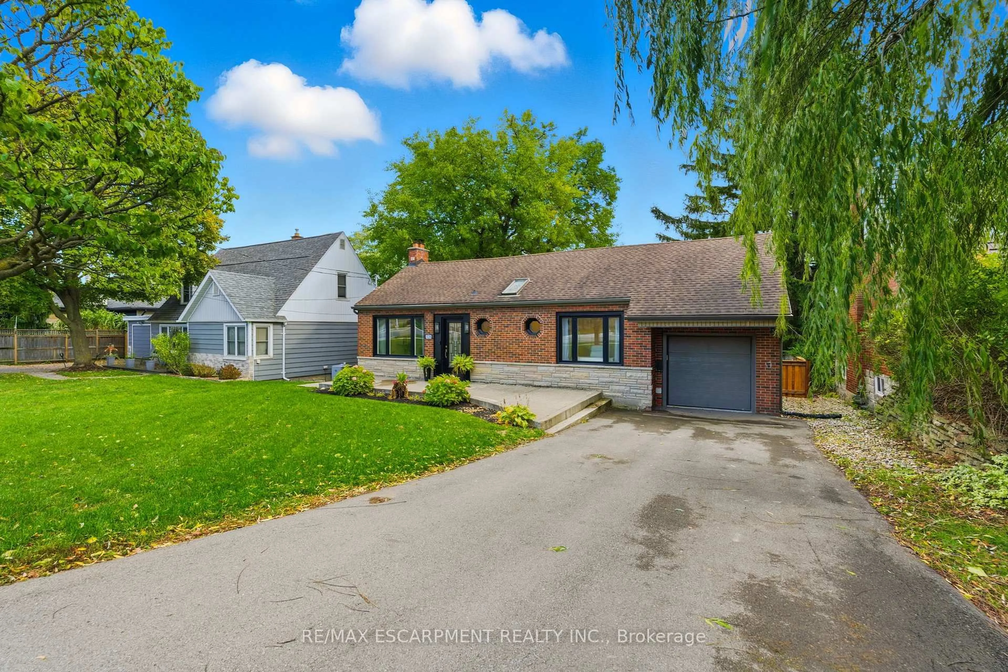 A pic from outside/outdoor area/front of a property/back of a property/a pic from drone, street for 424 Plains Rd, Burlington Ontario L7T 1G9