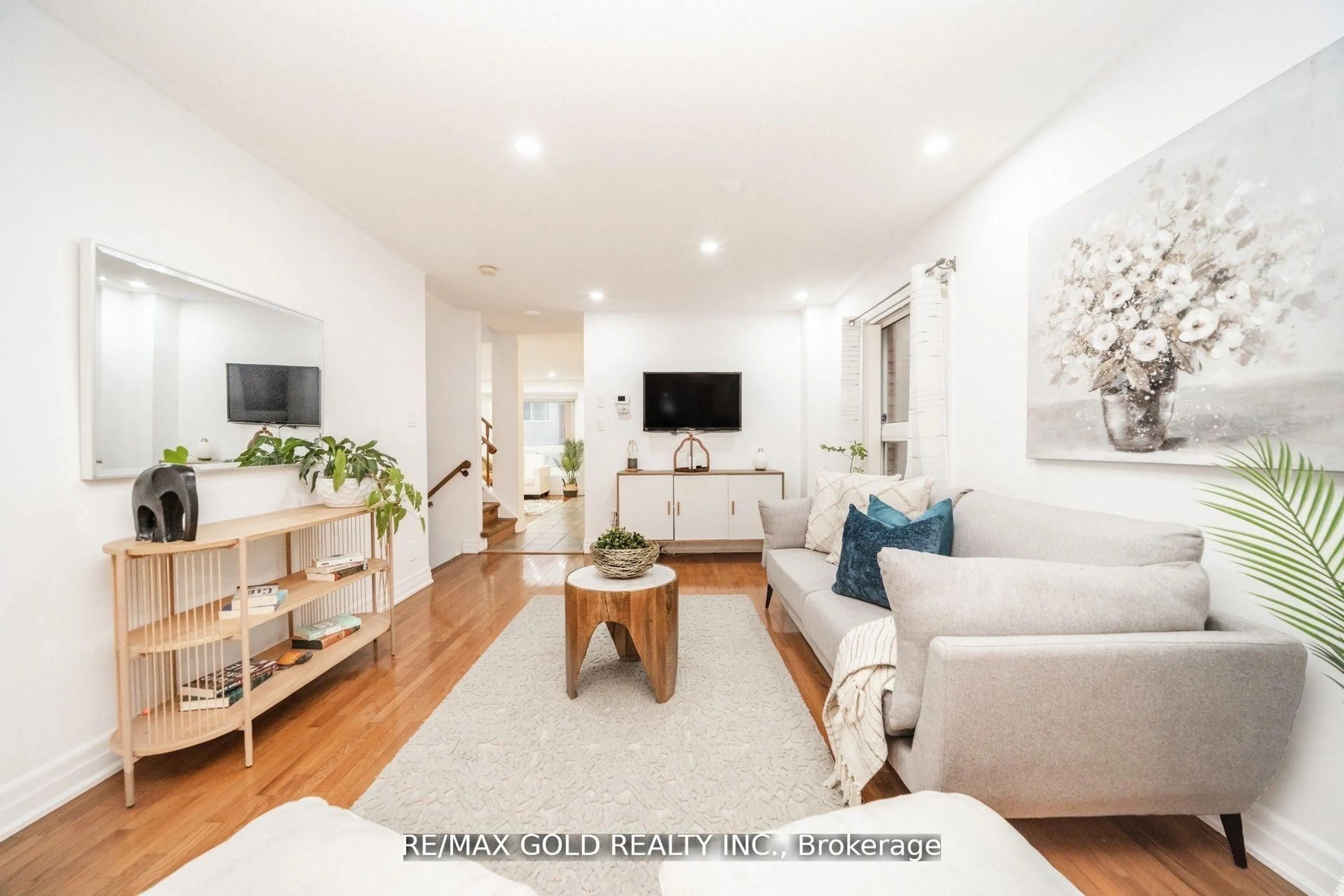 Living room with furniture, wood/laminate floor for 36 Roxton Cres, Brampton Ontario L7A 2A9