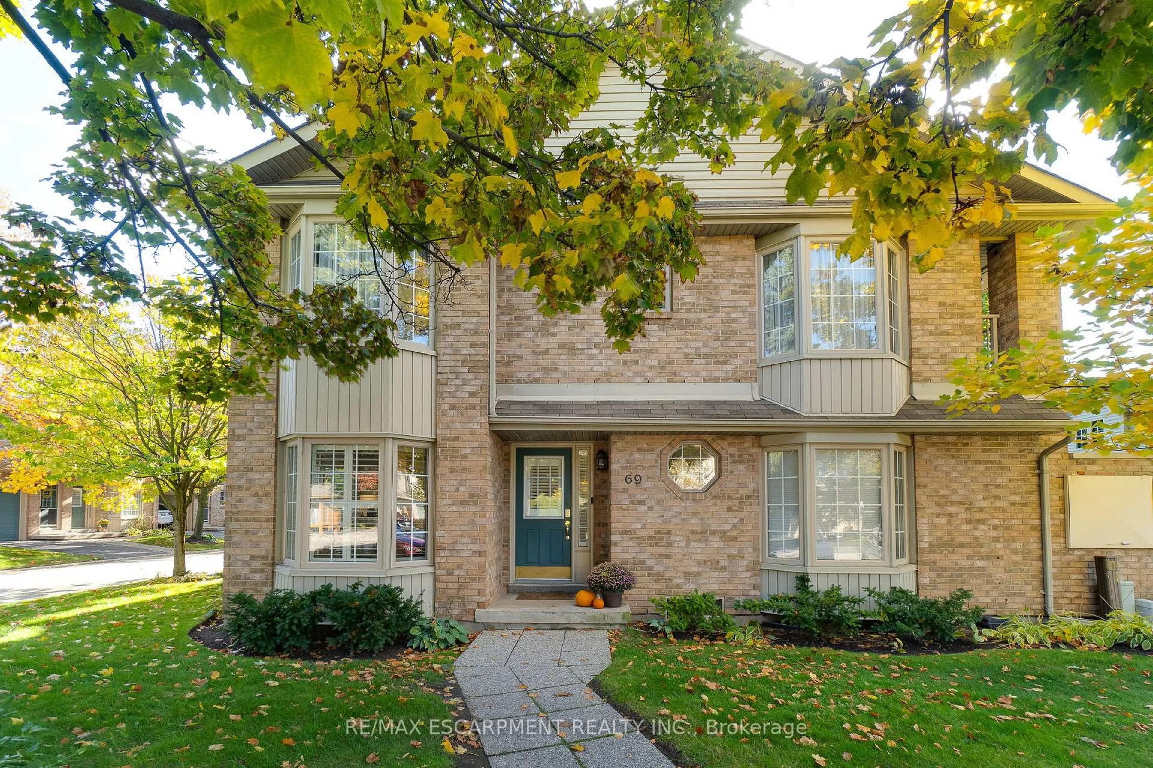 Home with brick exterior material, street for 3333 New St #69, Burlington Ontario L7N 1N1