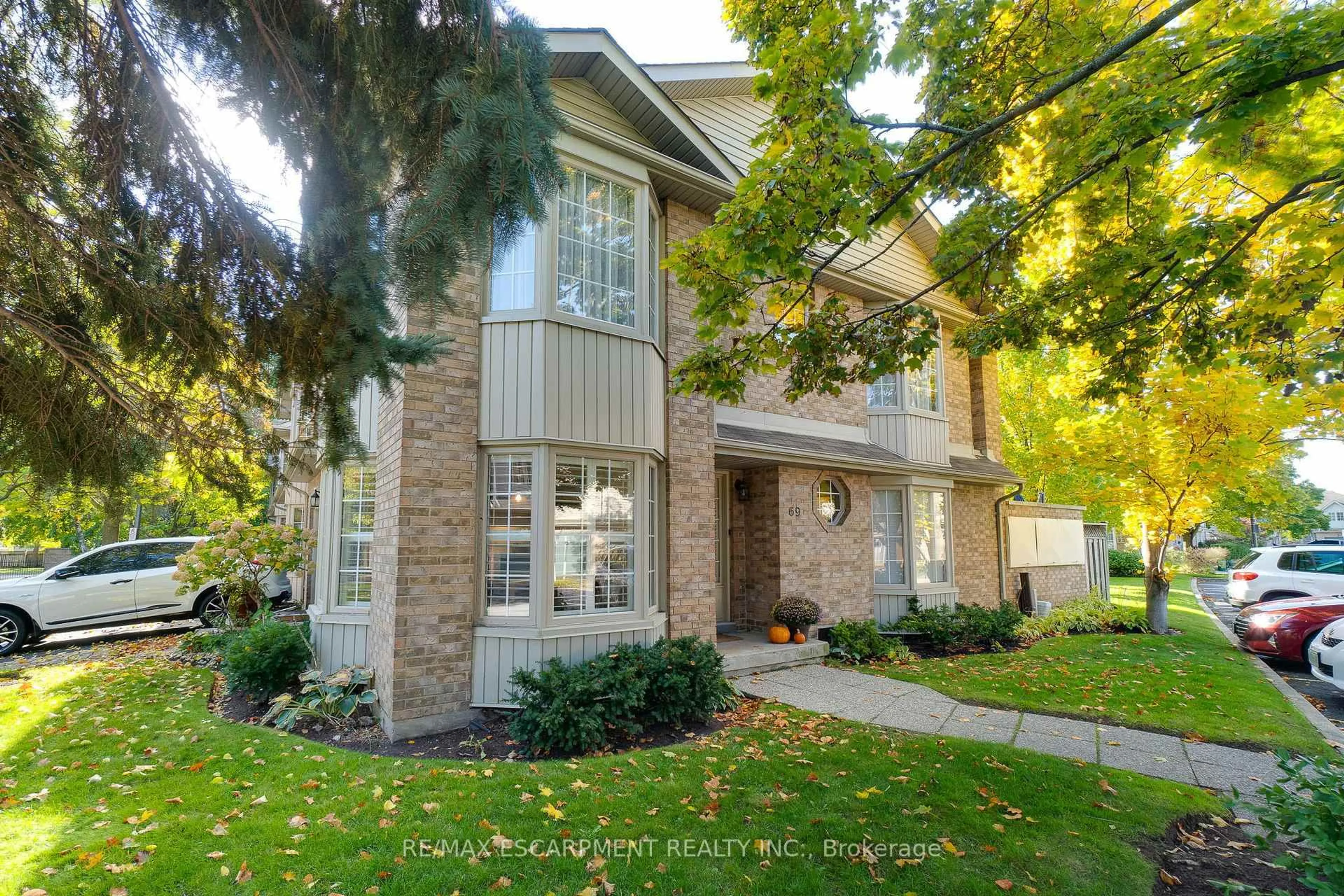 Home with brick exterior material, street for 3333 New St #69, Burlington Ontario L7N 1N1