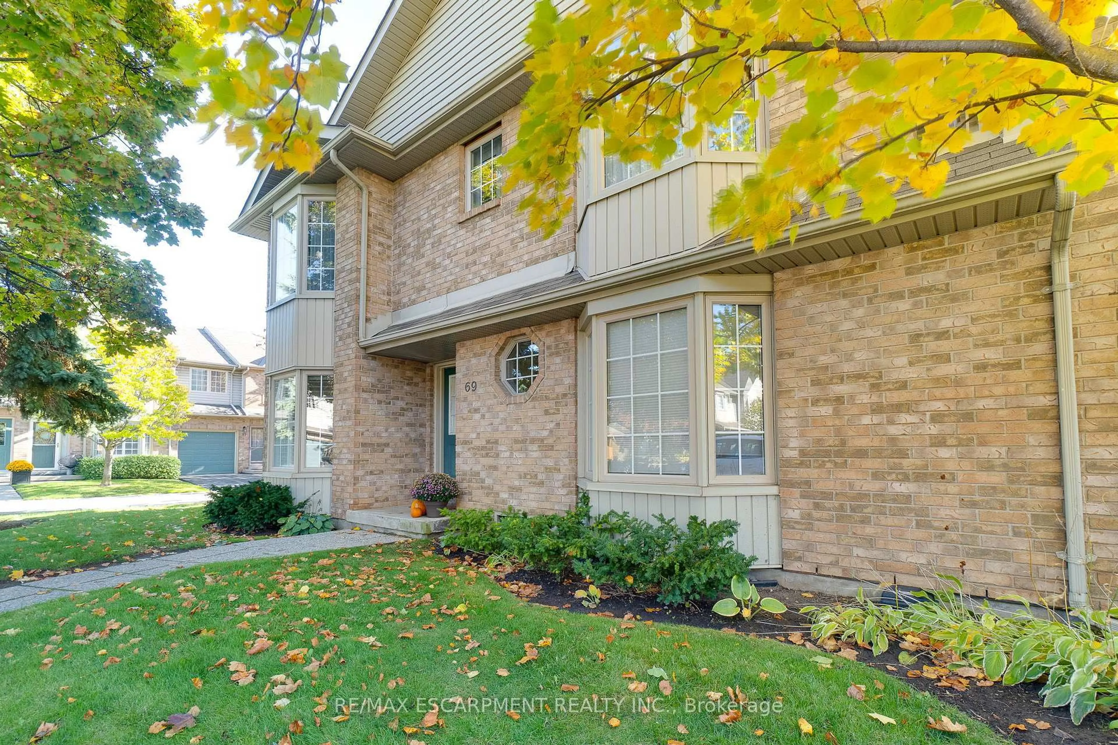 Home with brick exterior material, street for 3333 New St #69, Burlington Ontario L7N 1N1