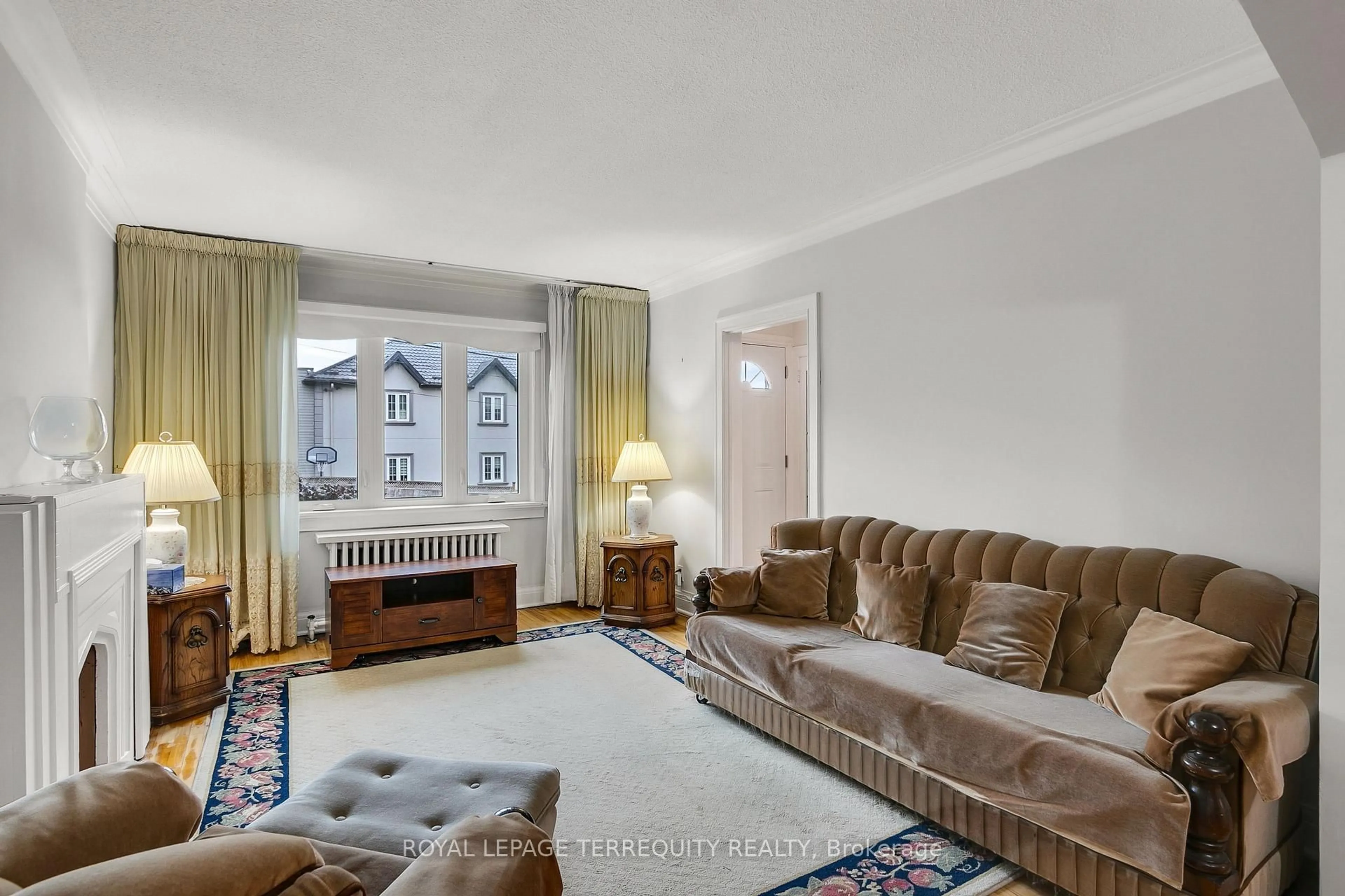 Living room with furniture, carpet floor for 110 Cameron Ave, Toronto Ontario M6M 1R3